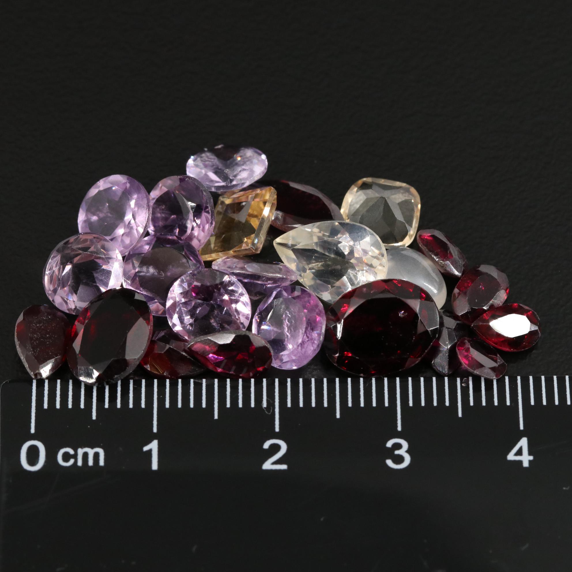 Loose 24.55 CTW Amethyst, Citrine and Garnet Lot