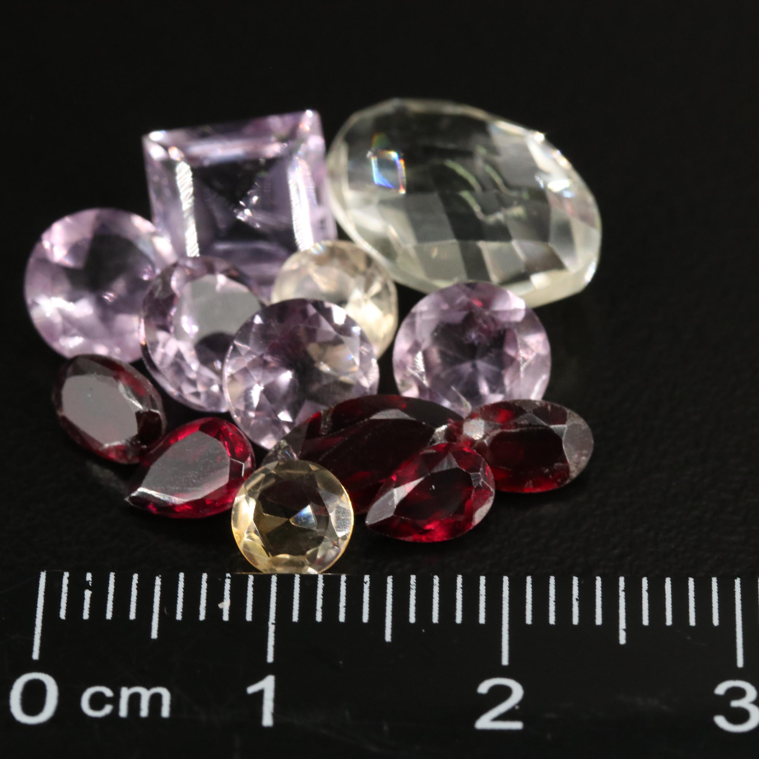 Loose 17.62 CTW Amethyst, Citrine, and Garnet lot