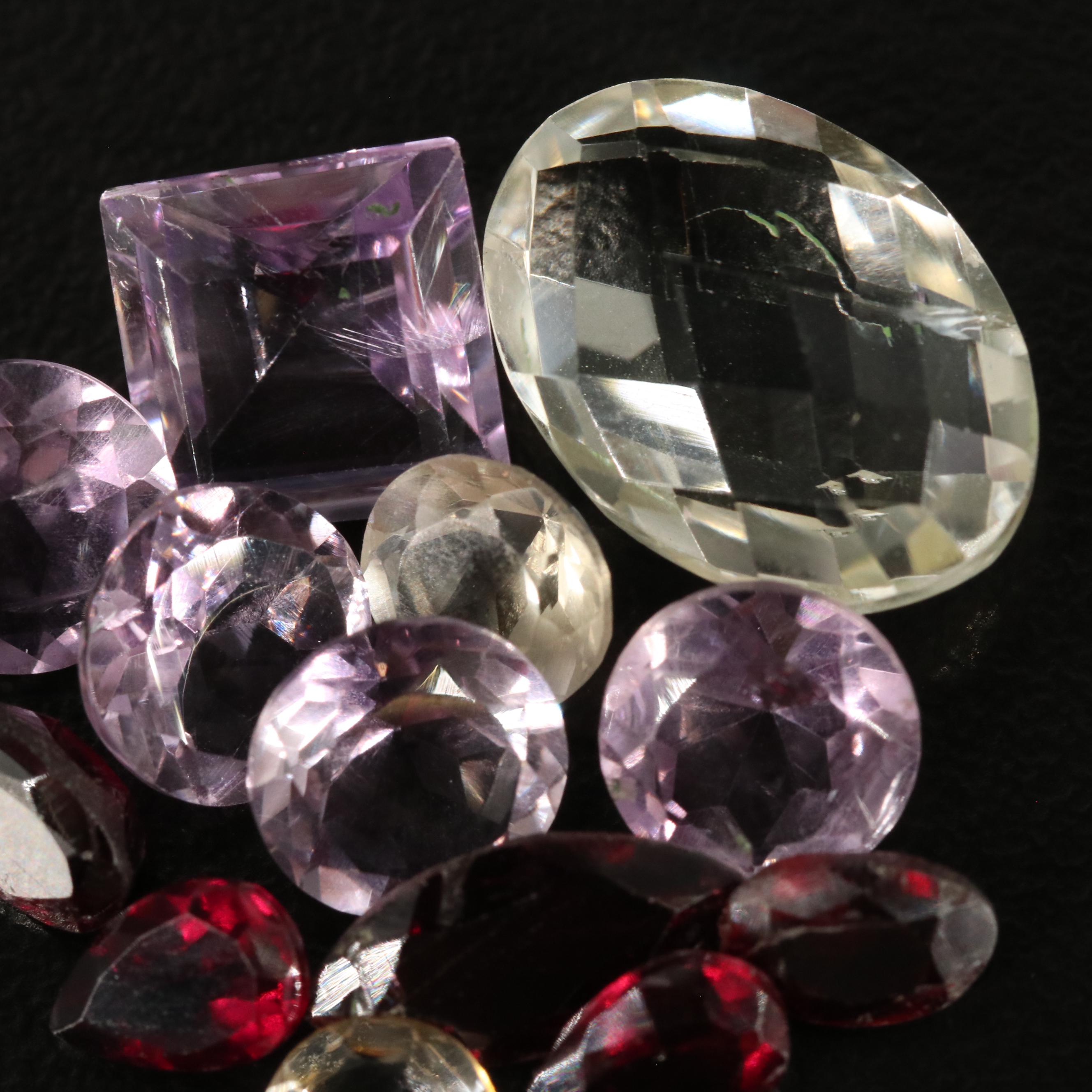 Loose 17.62 CTW Amethyst, Citrine, and Garnet lot