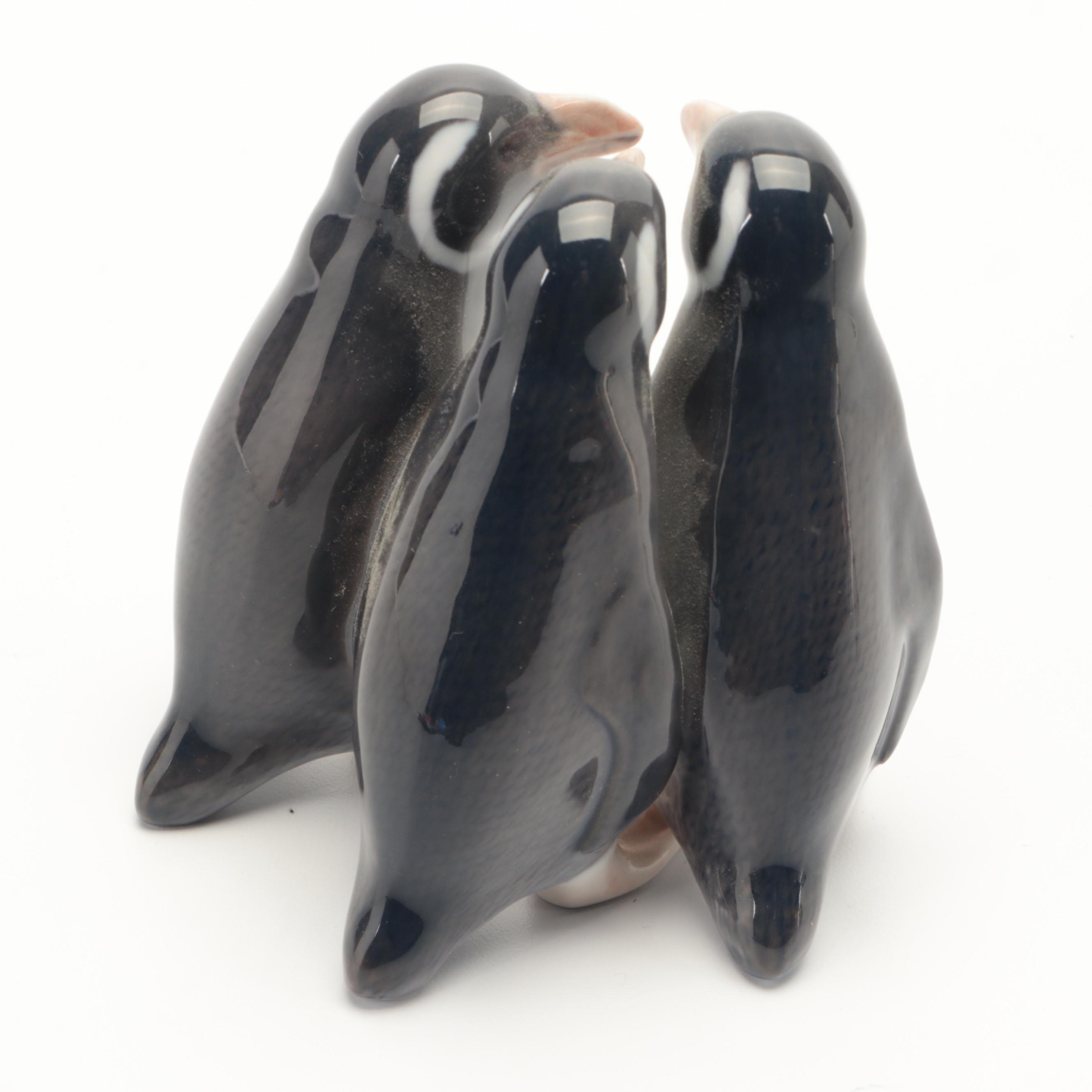 Royal Copenhagen "Penguin" and "Penguins Trio" Porcelain Figurines