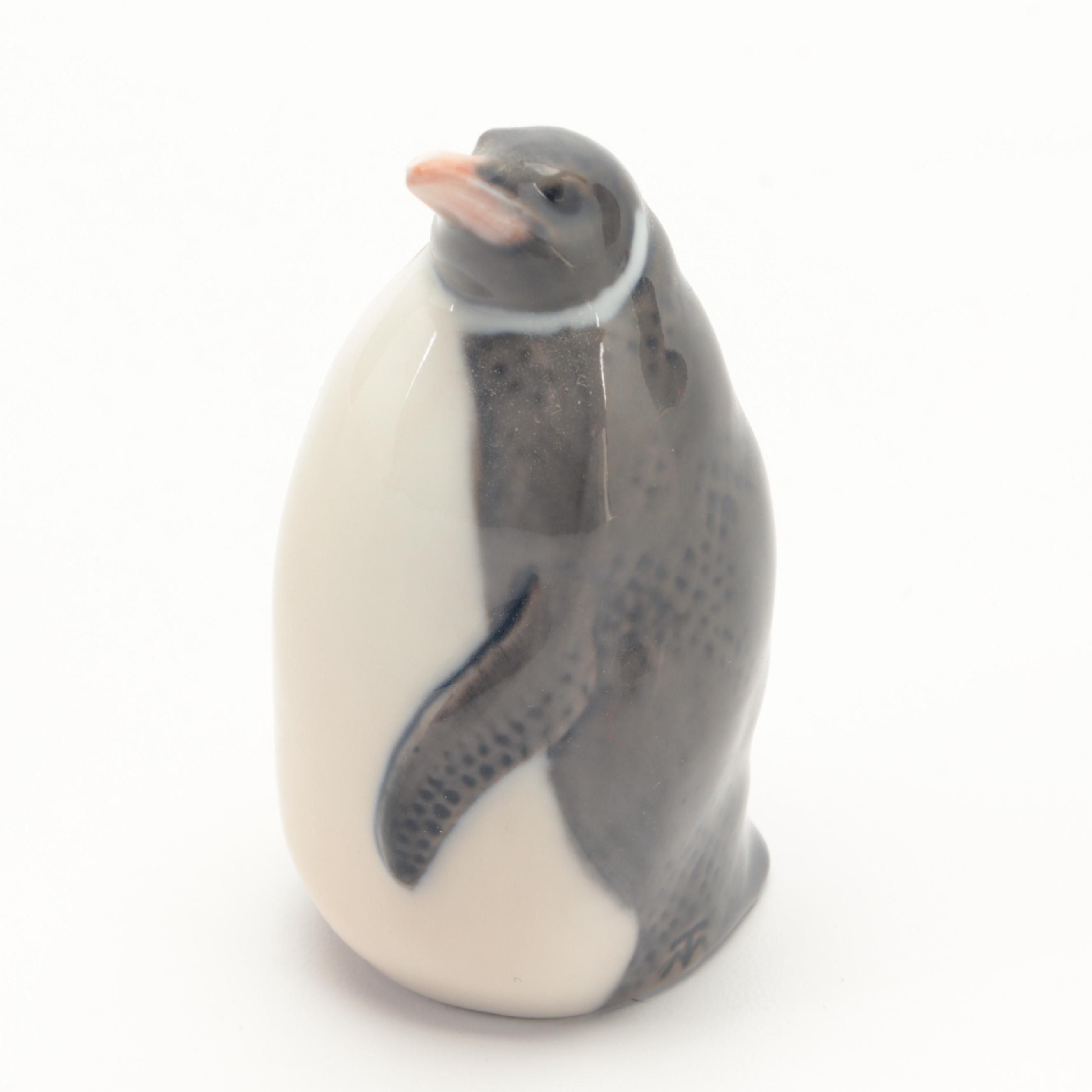 Royal Copenhagen "Penguin" and "Penguins Trio" Porcelain Figurines