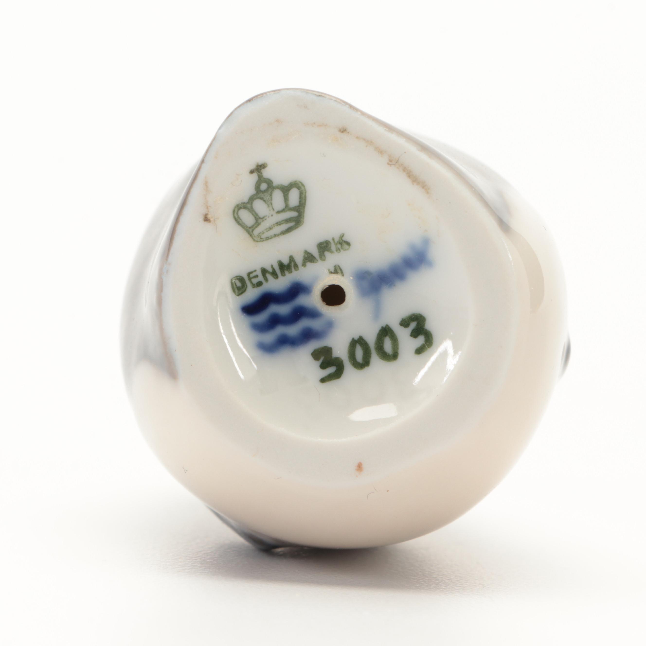 Royal Copenhagen "Penguin" and "Penguins Trio" Porcelain Figurines