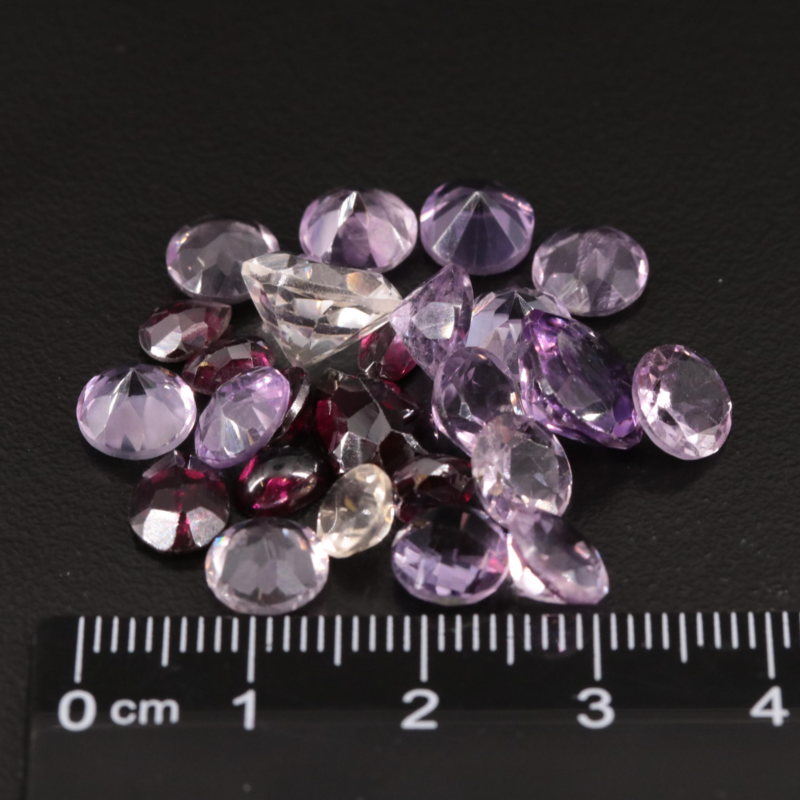 Loose 31.85 CTW Amethyst, Citrine, and Garnet Lot