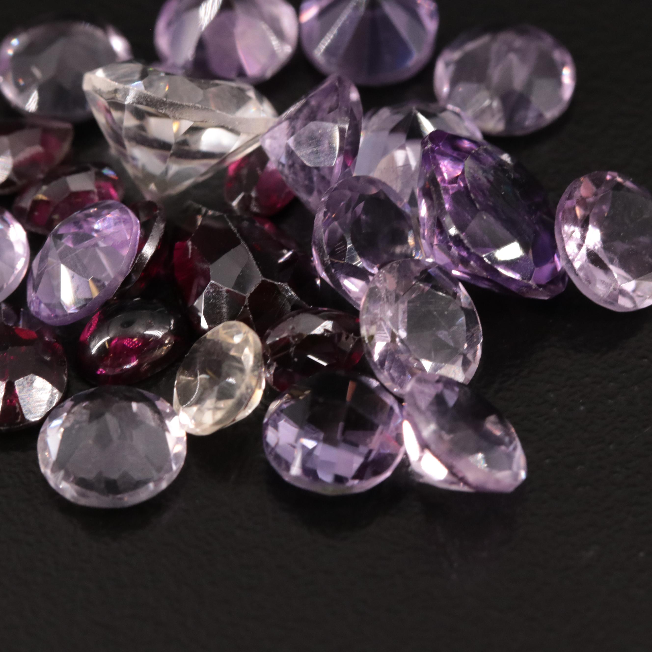 Loose 31.85 CTW Amethyst, Citrine, and Garnet Lot