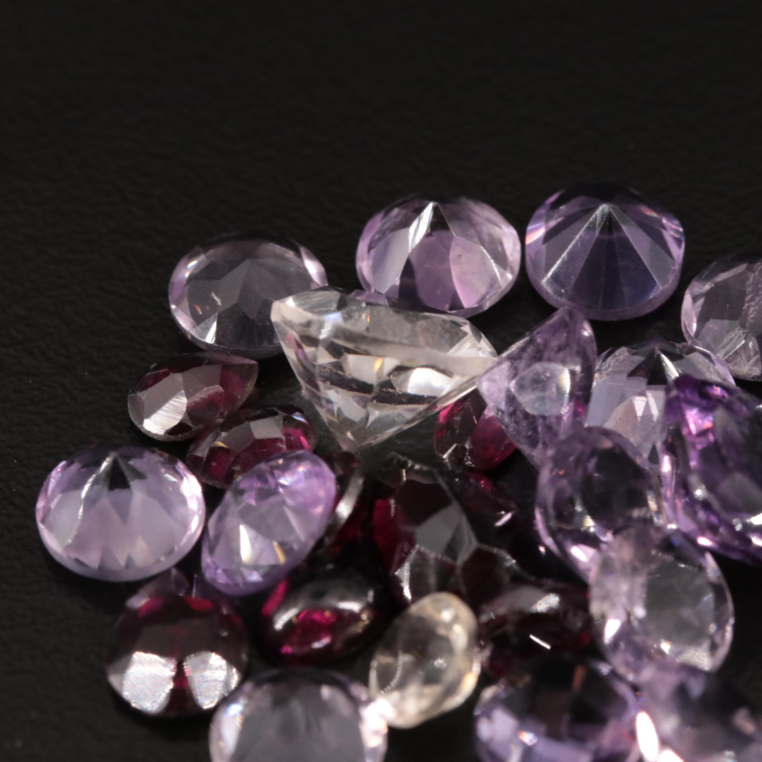 Loose 31.85 CTW Amethyst, Citrine, and Garnet Lot