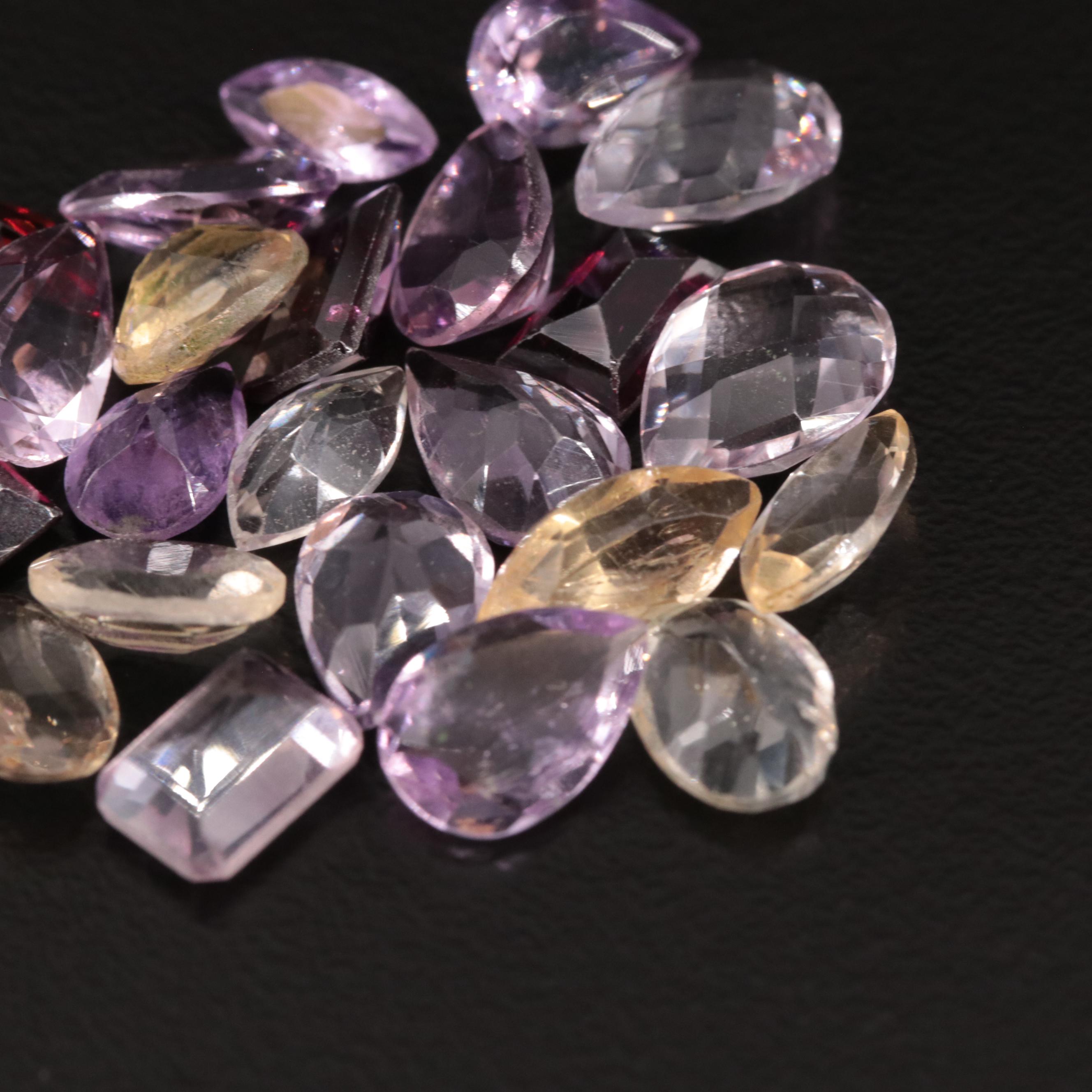 Loose 24.54 CTW Amethyst, Citrine, and Garnet Lot