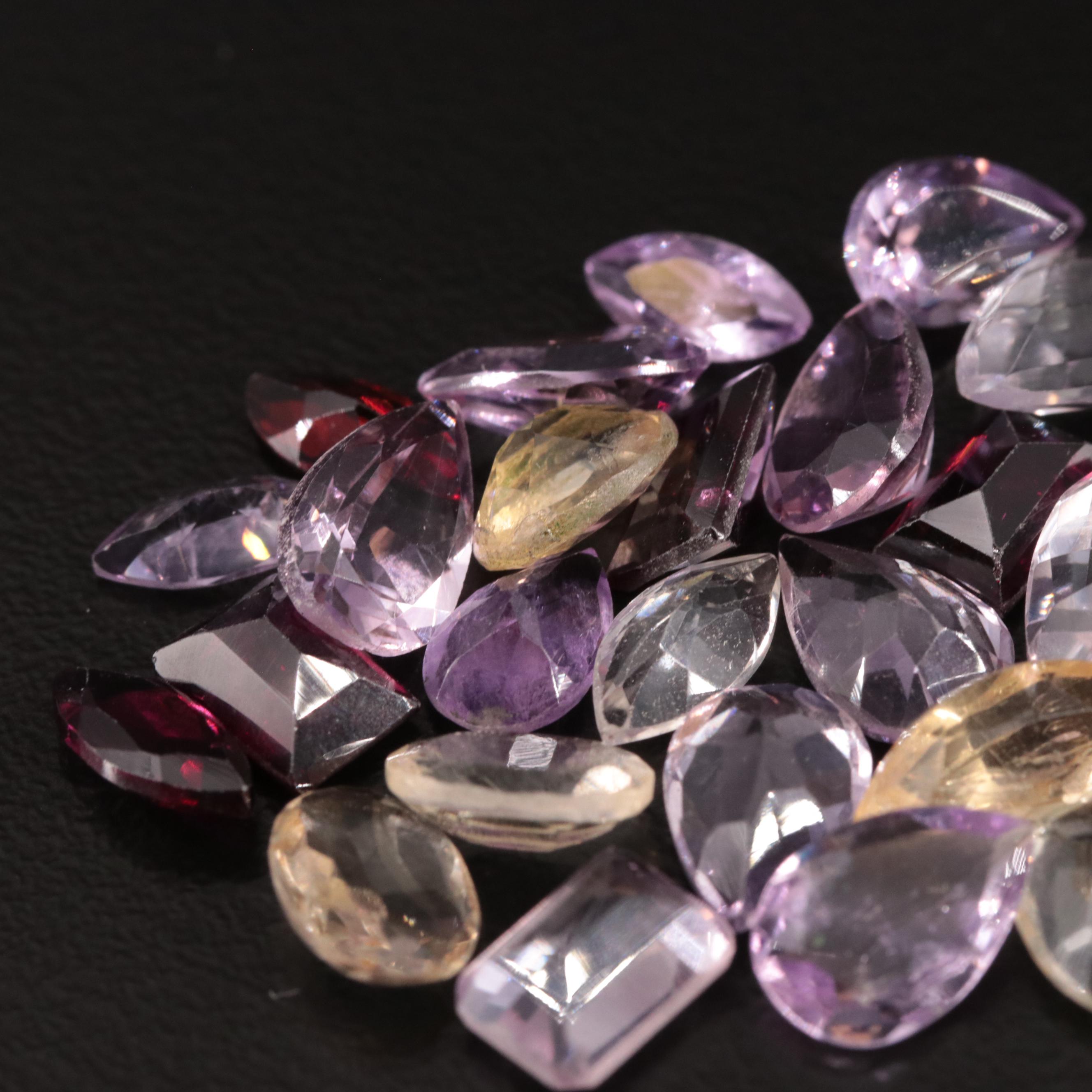 Loose 24.54 CTW Amethyst, Citrine, and Garnet Lot