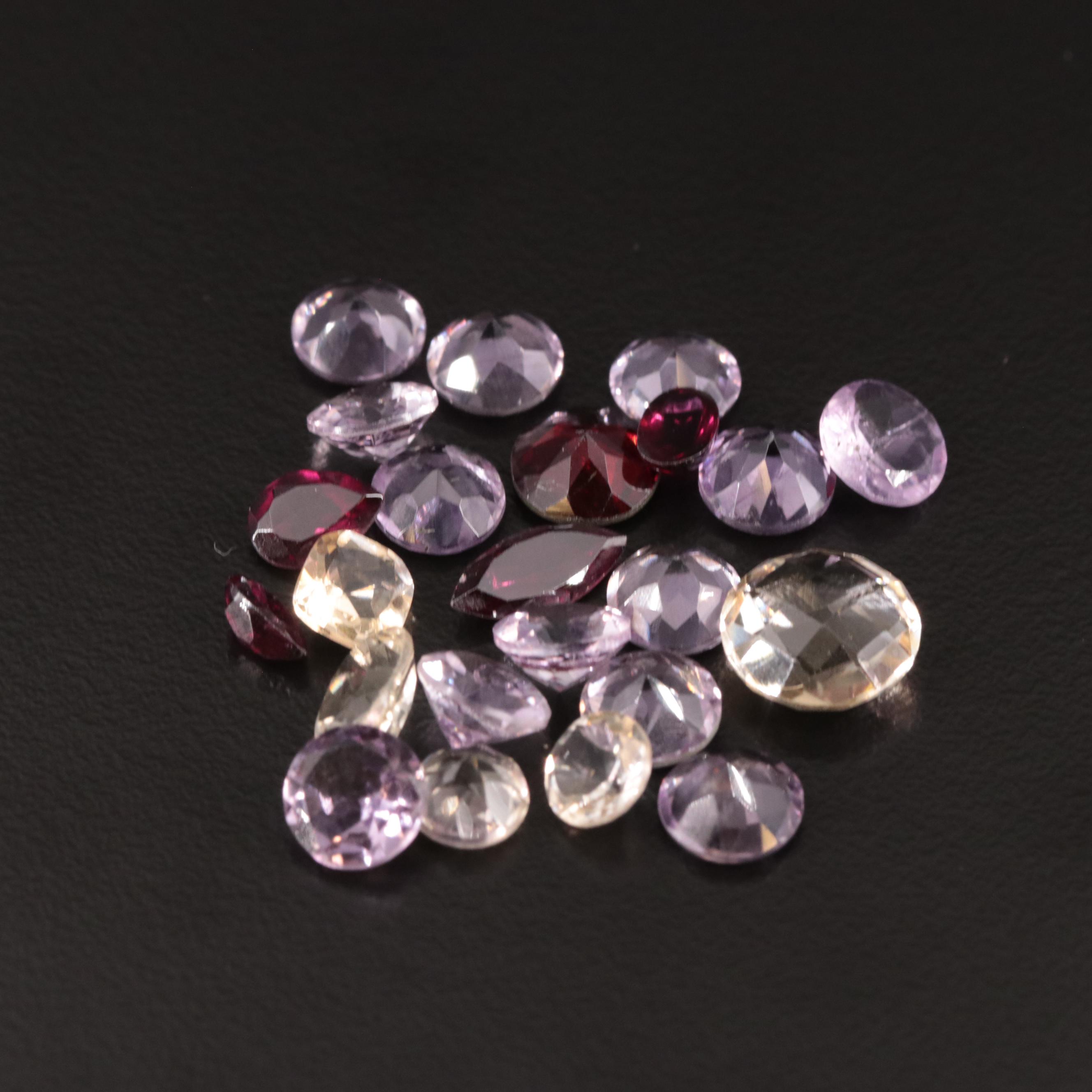 Loose 25.07 CTW Amethyst, Citrine, and Garnet Lot