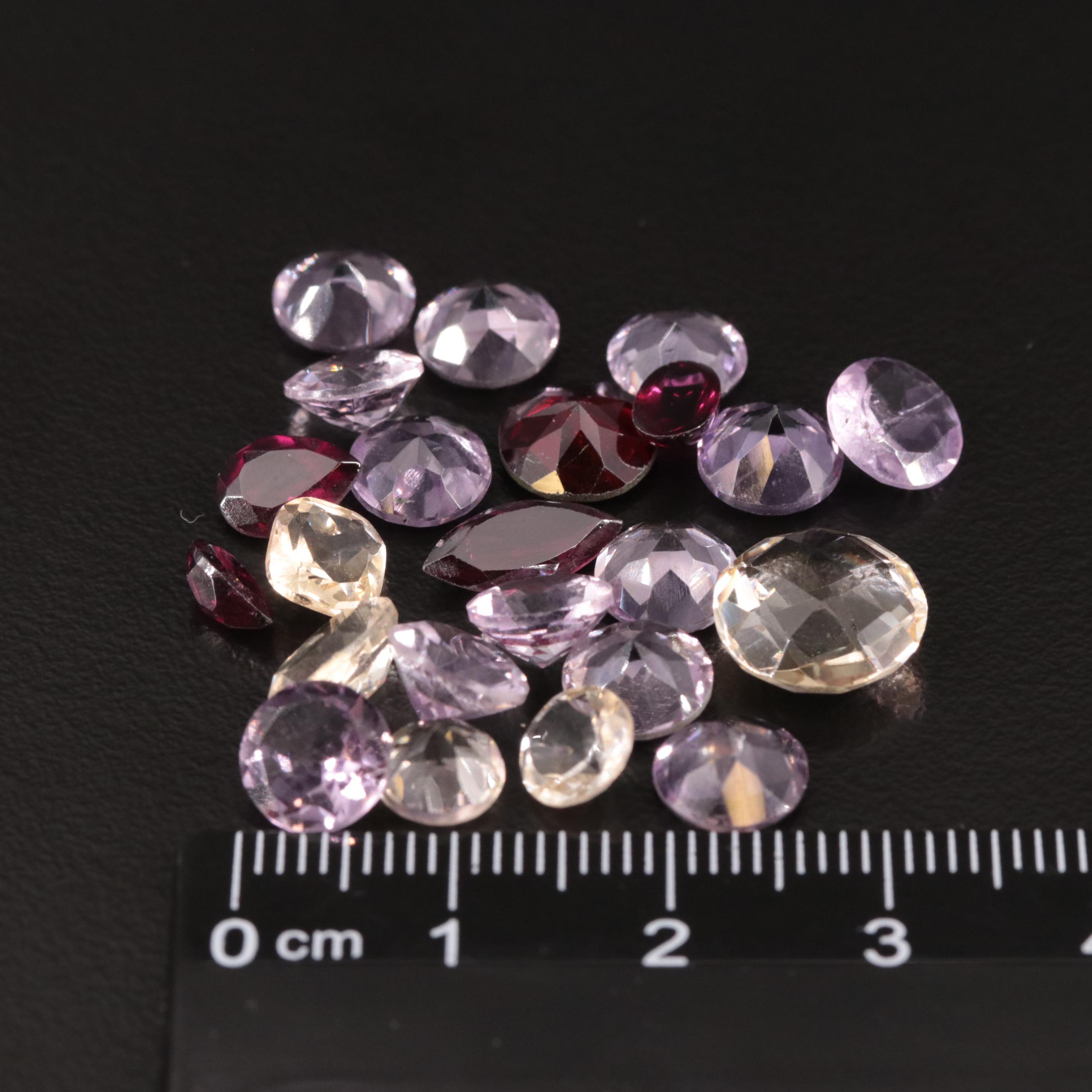 Loose 25.07 CTW Amethyst, Citrine, and Garnet Lot