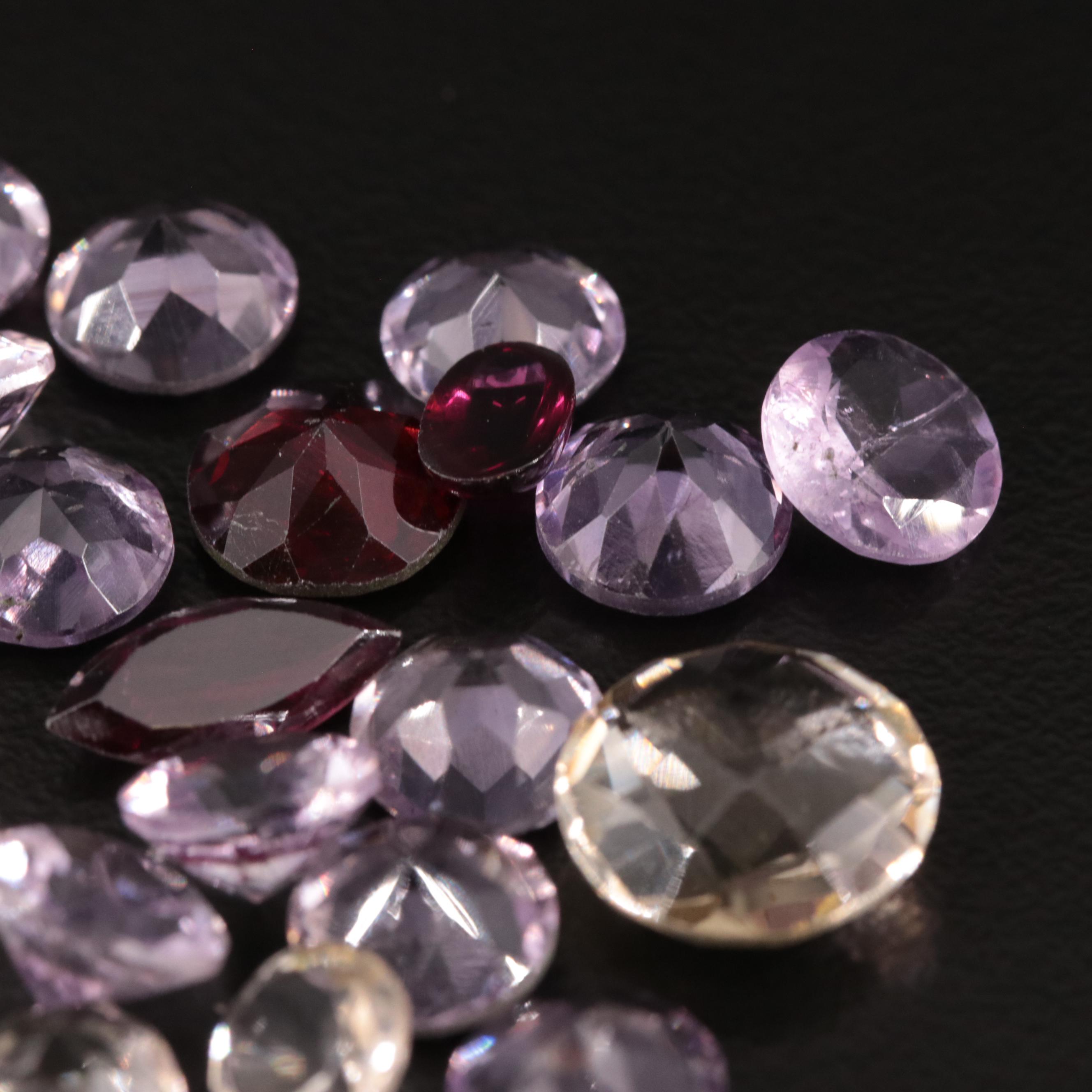 Loose 25.07 CTW Amethyst, Citrine, and Garnet Lot