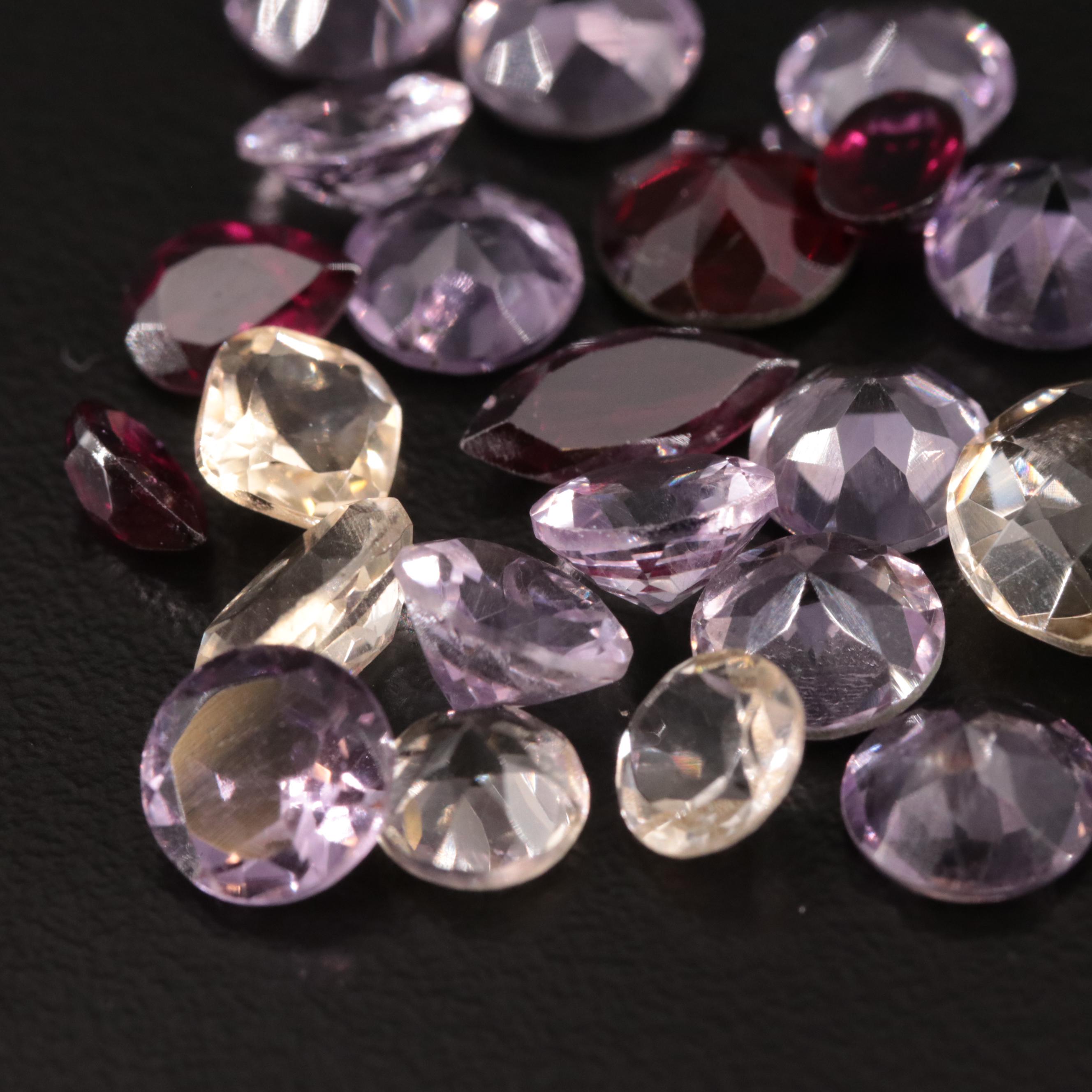 Loose 25.07 CTW Amethyst, Citrine, and Garnet Lot