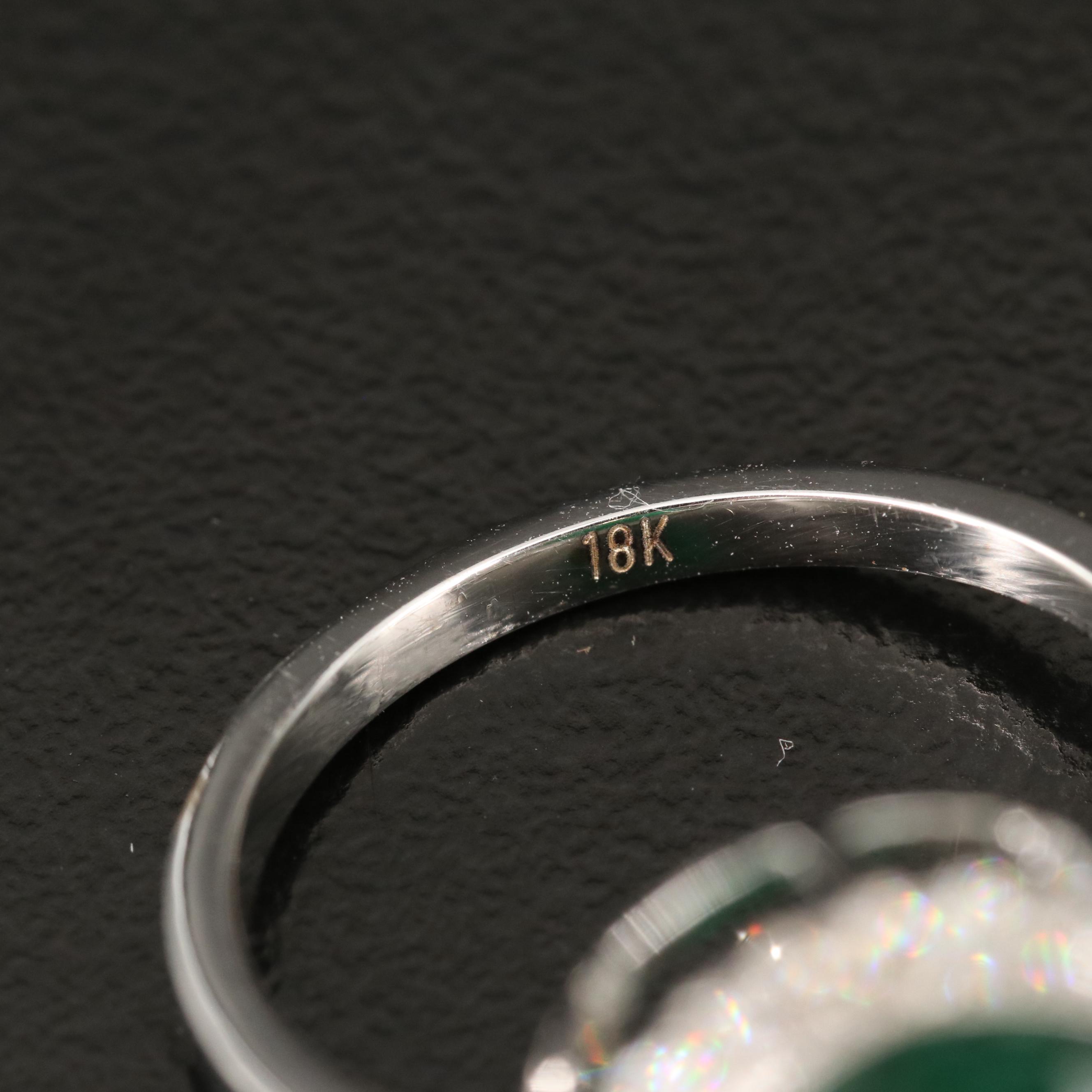 18K 6.42 CT Emerald and Diamond Halo Ring