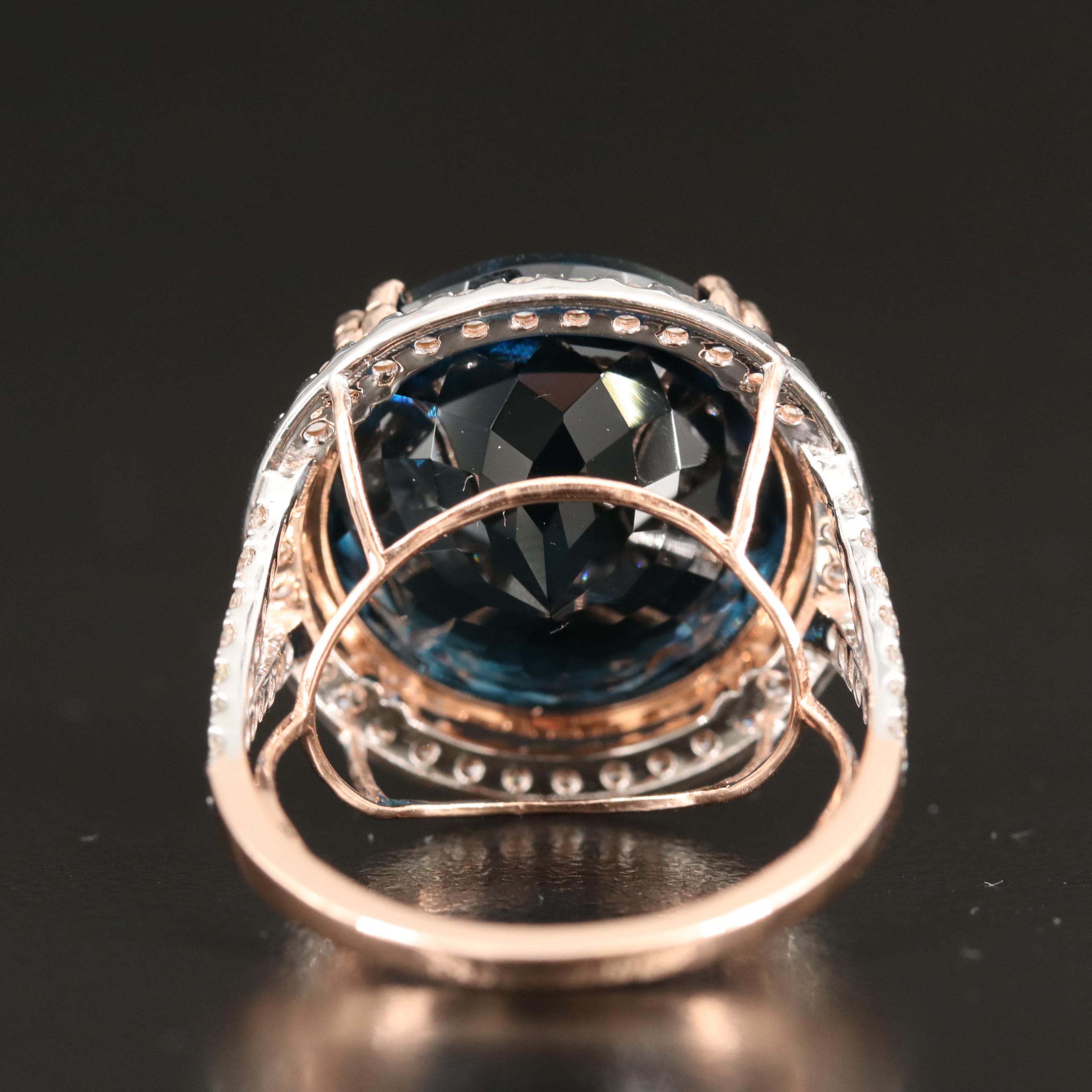 14K 26.70 CT London Blue Topaz and 1.05 CTW Diamond Cathedral Set Ring
