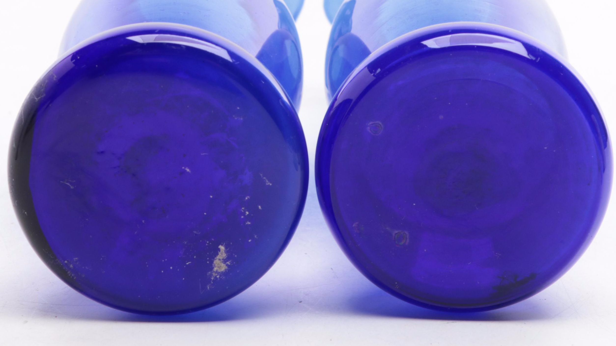 Isabel Bloom Painted Concrete Figurines with Cobalt Glass Vases