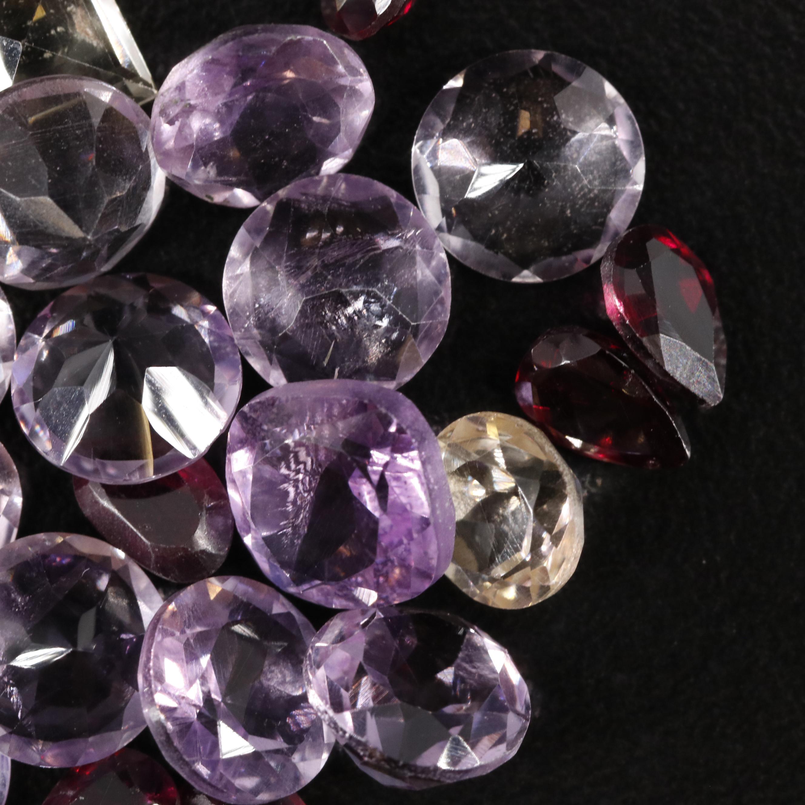 Loose 22.95 CTW Amethyst, Citrine, and Garnet Lot