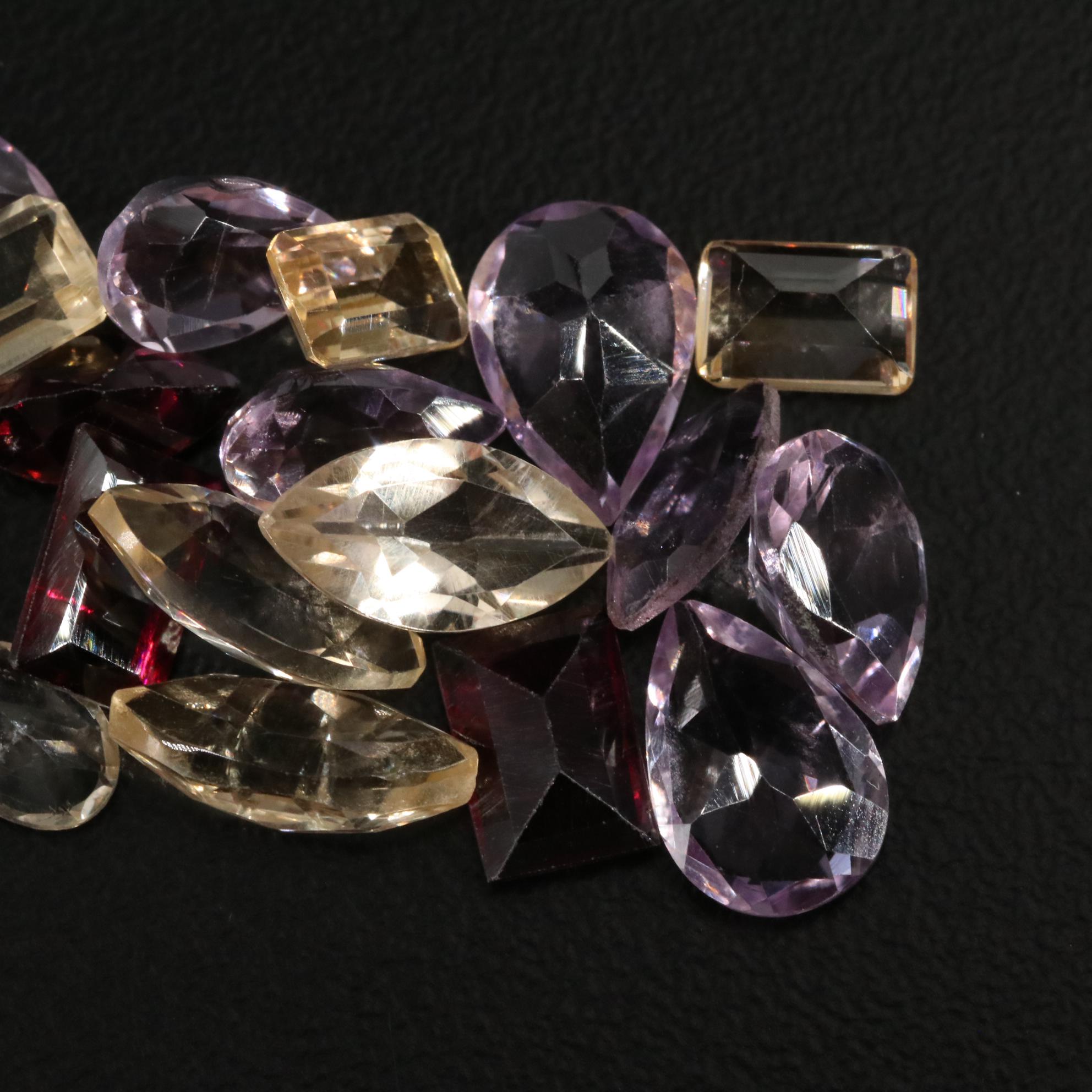 Loose 20.75 CTW Amethyst, Citrine, and Garnet Lot