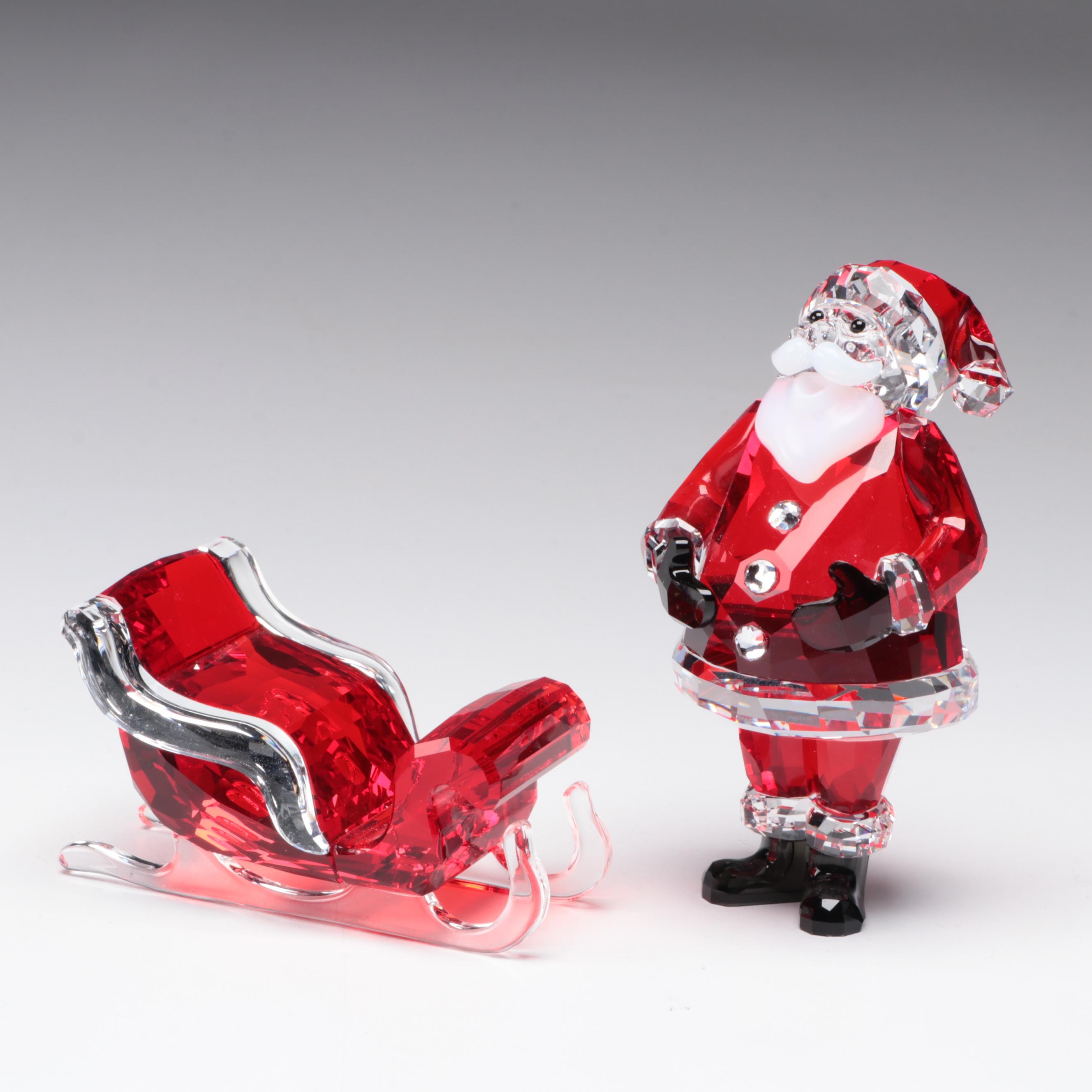 Swarovski Crystal Santa Claus, Reindeer, Sleigh, and Dog Figurines
