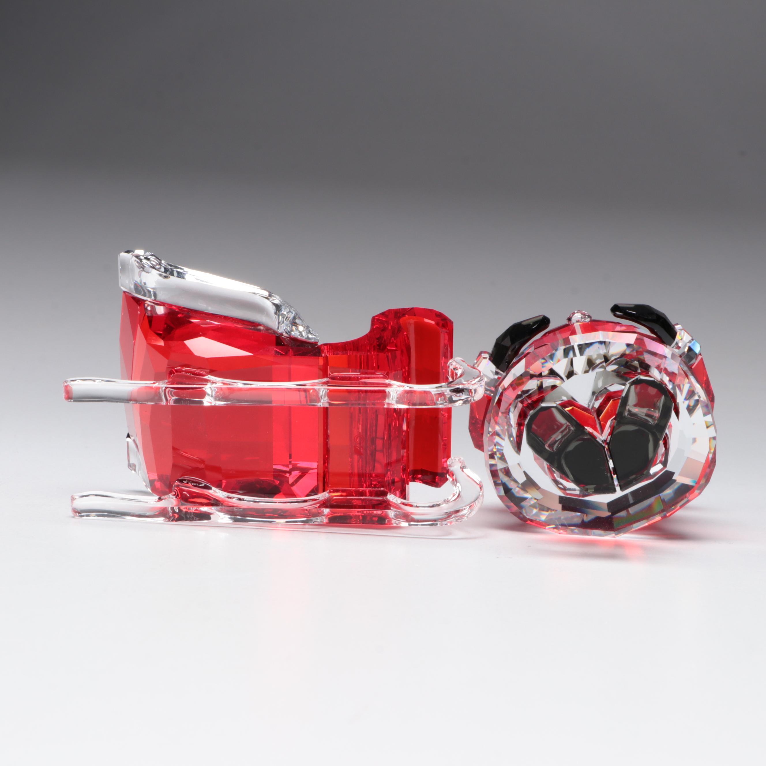 Swarovski Crystal Santa Claus, Reindeer, Sleigh, and Dog Figurines