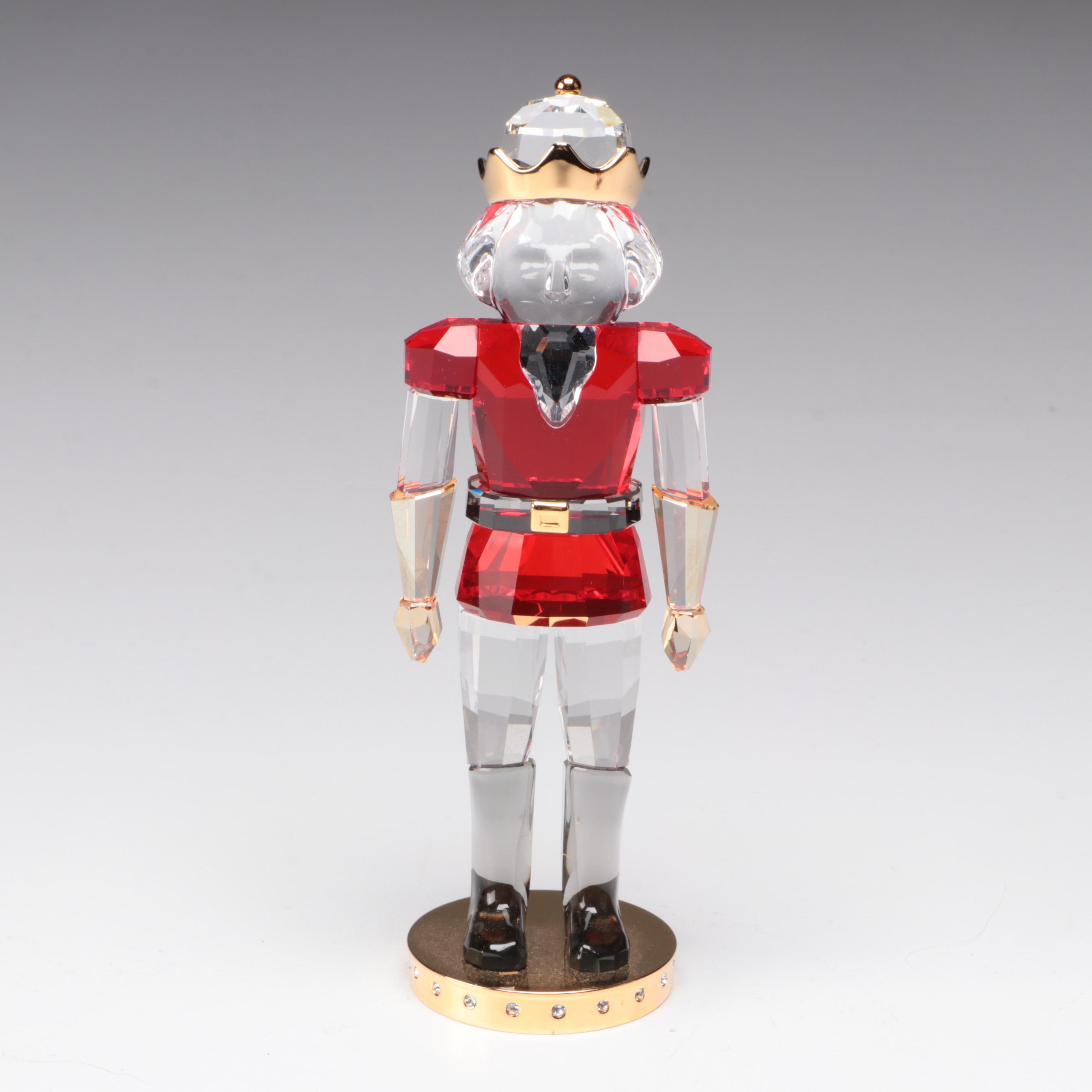 Swarovski Crystal Nutcracker and Poinsettia Figurines