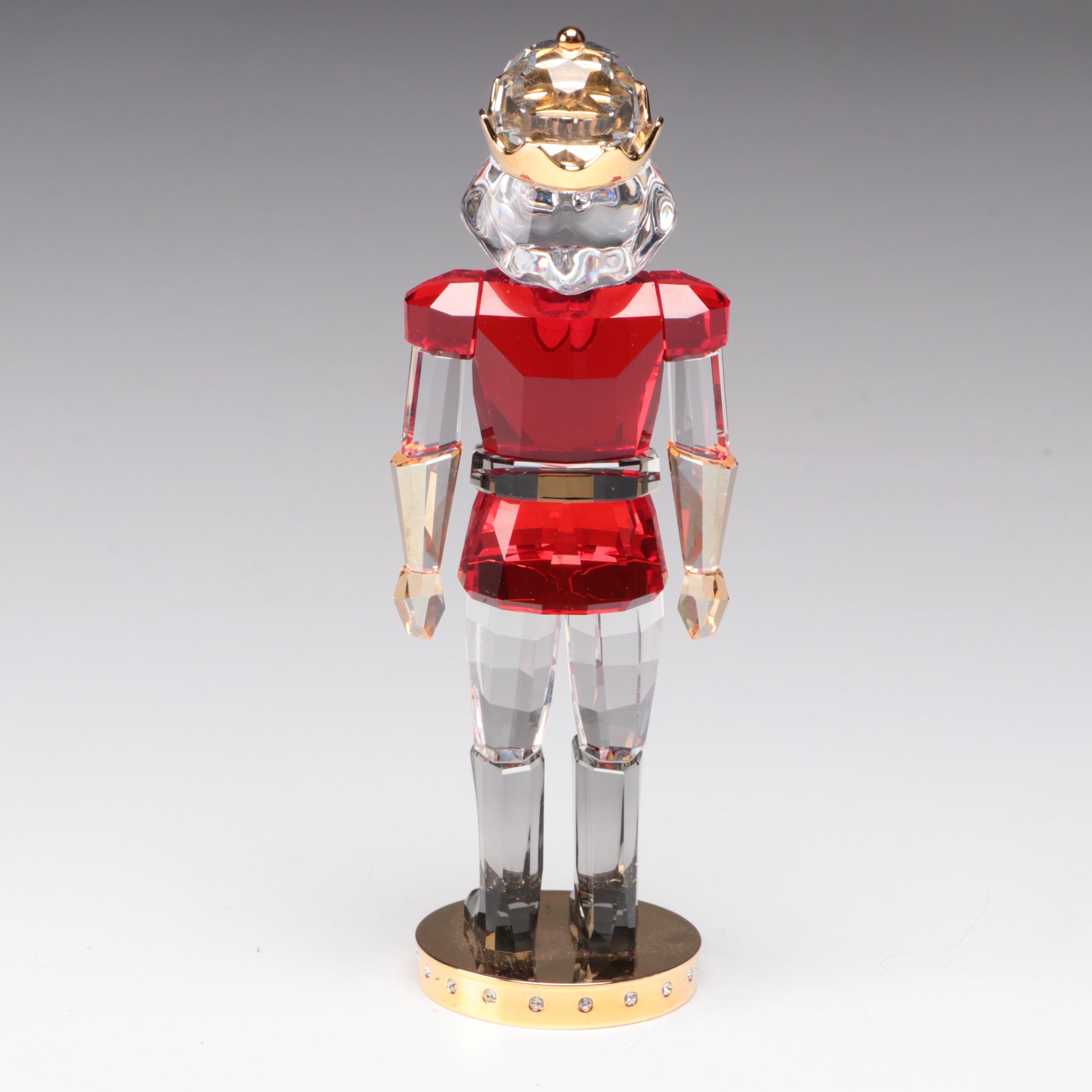 Swarovski Crystal Nutcracker and Poinsettia Figurines