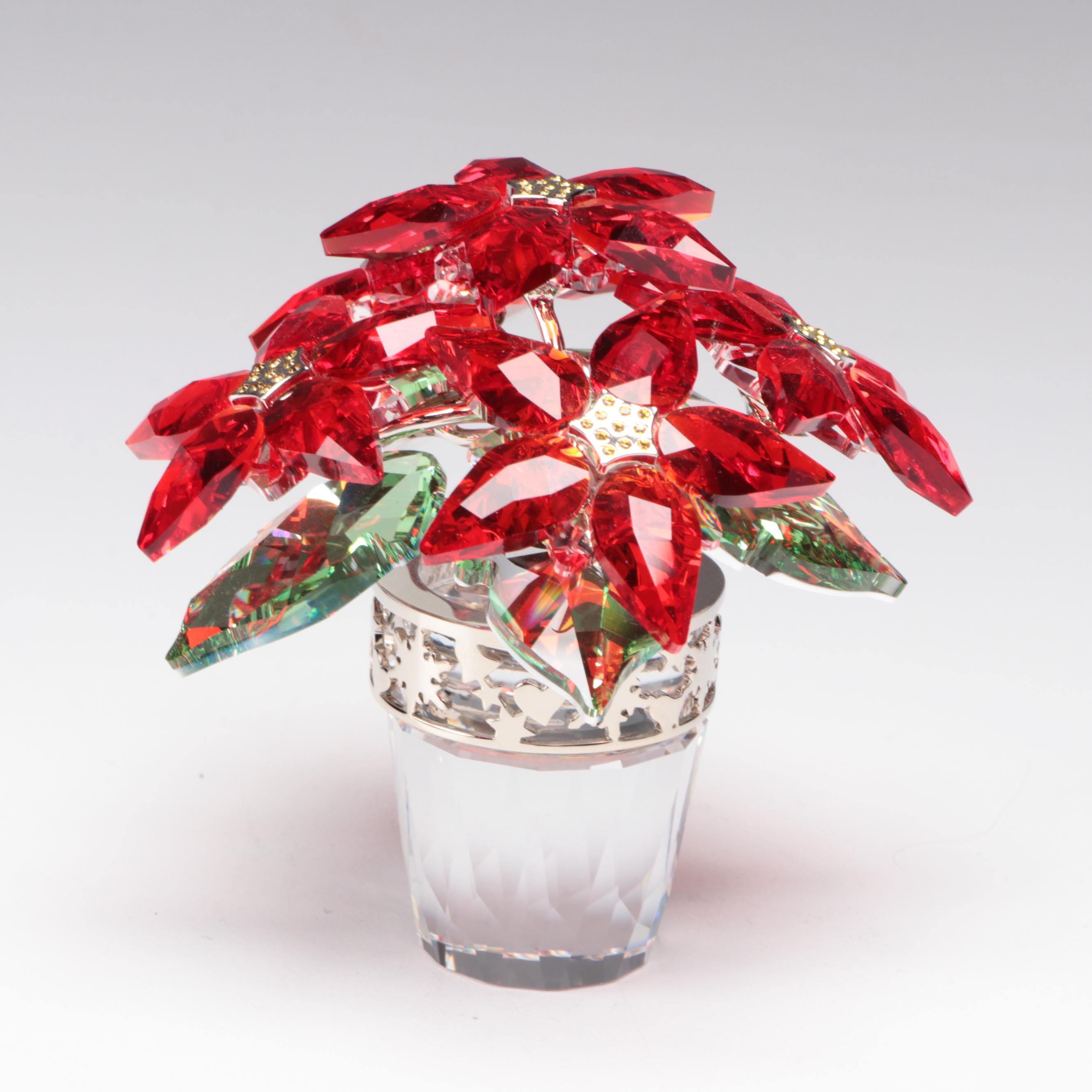 Swarovski Crystal Nutcracker and Poinsettia Figurines