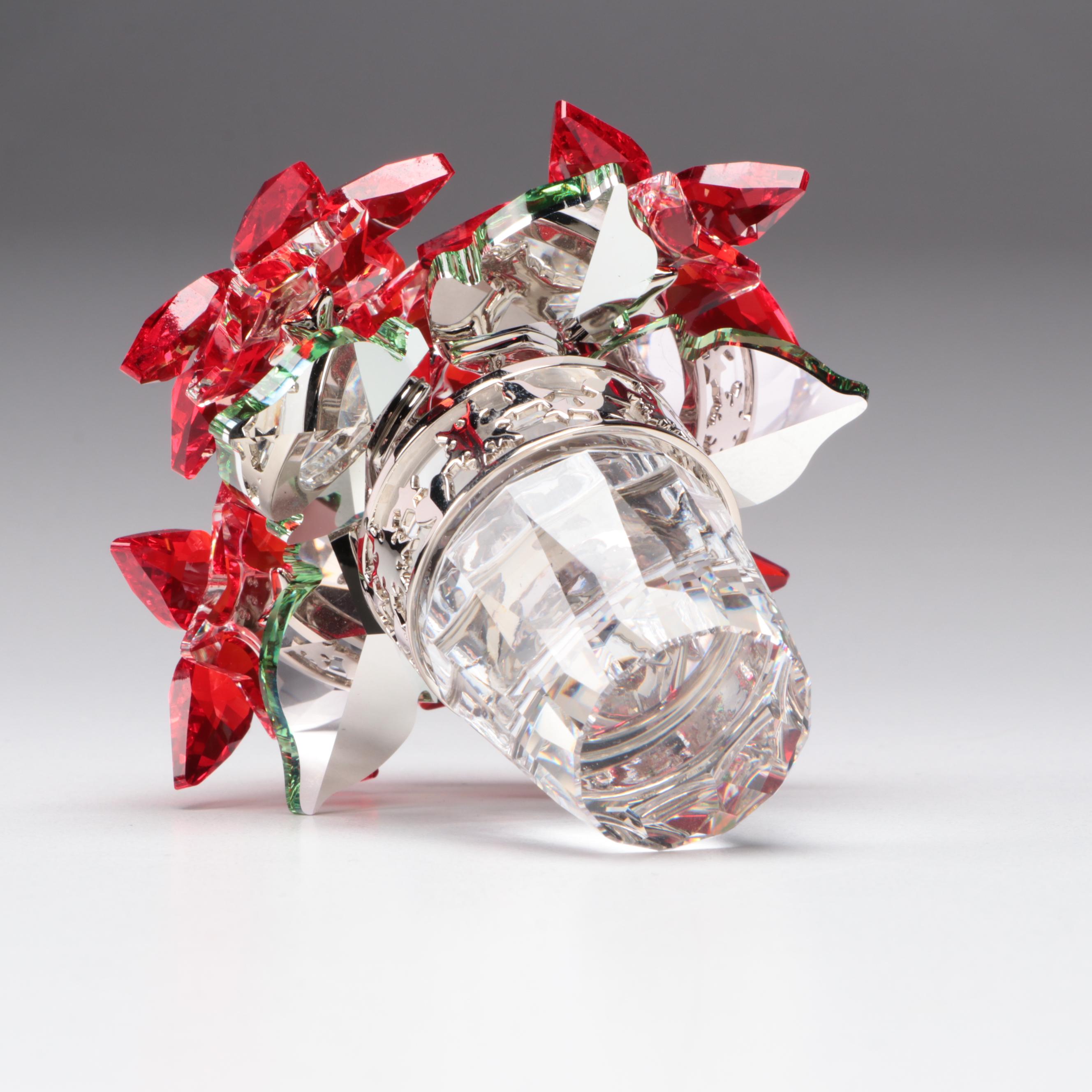 Swarovski Crystal Nutcracker and Poinsettia Figurines