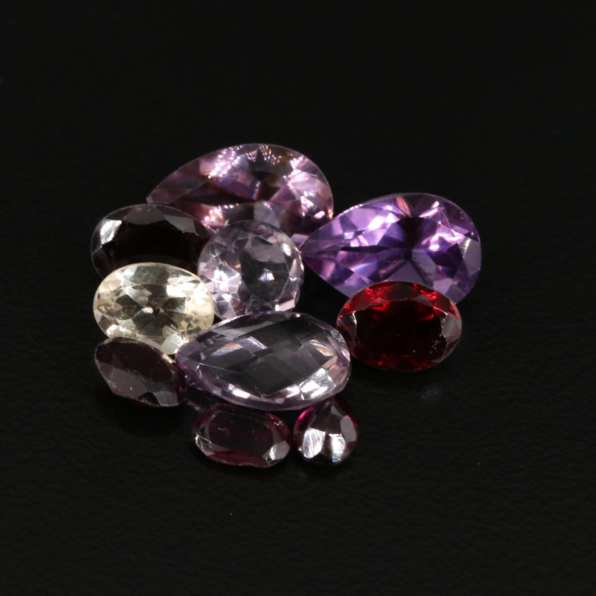 Loose 15.87 CTW Amethyst, Citrine, and Garnet Lot