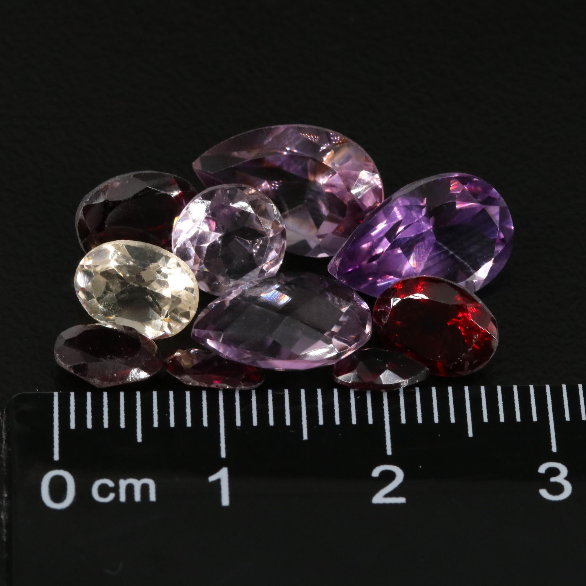 Loose 15.87 CTW Amethyst, Citrine, and Garnet Lot