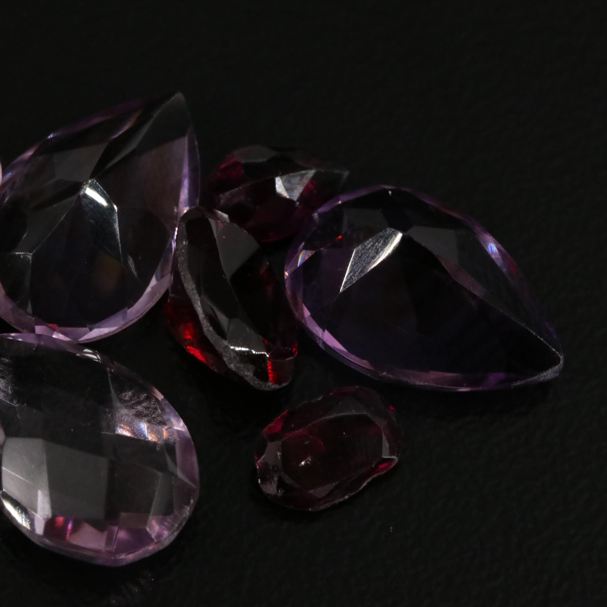 Loose 15.87 CTW Amethyst, Citrine, and Garnet Lot