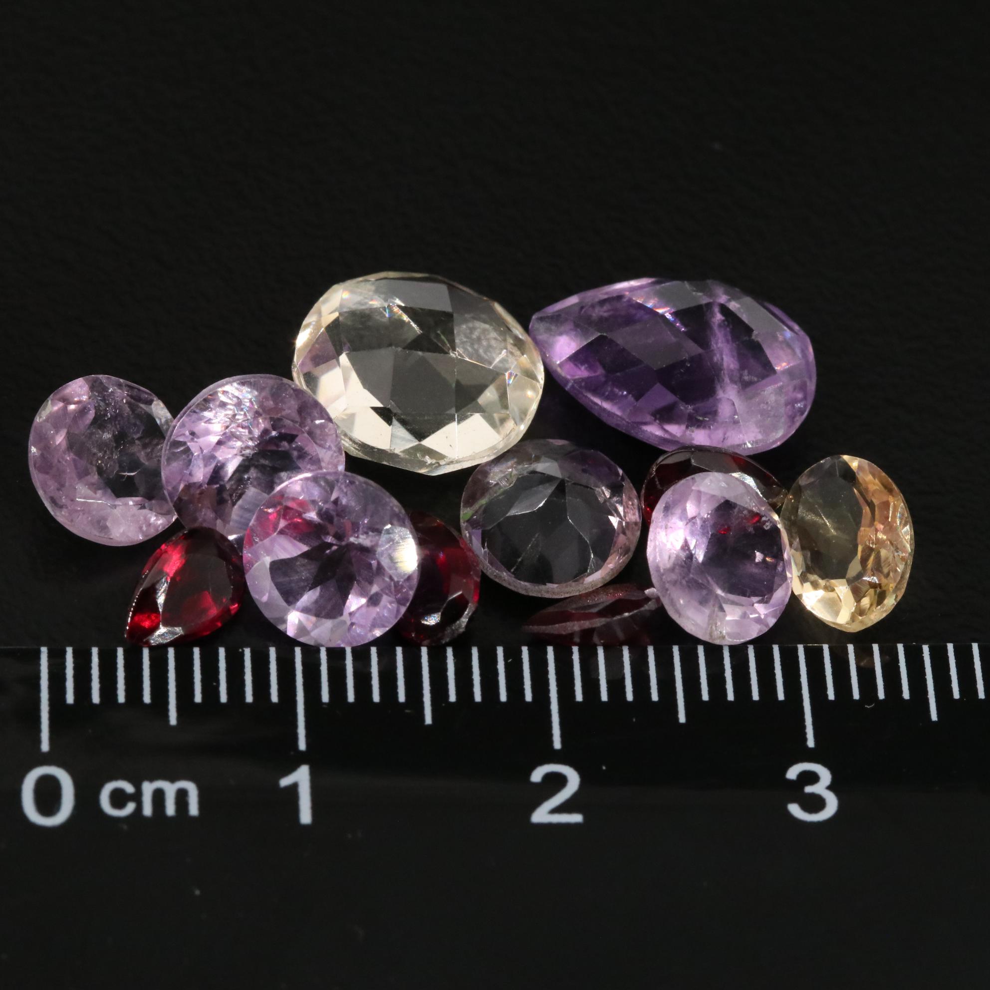 Loose 15.25 CTW Amethyst, Citrine, and Garnet Lot