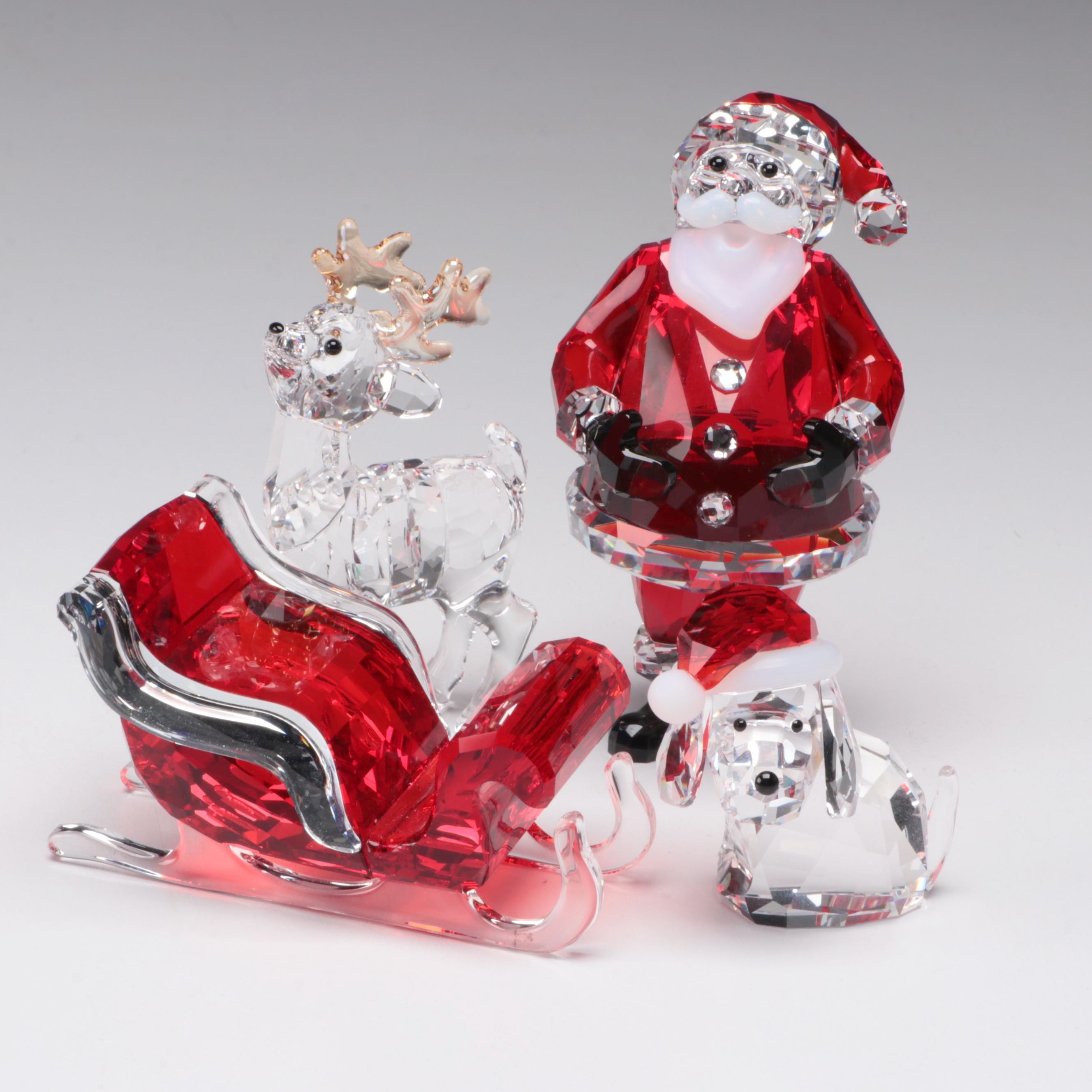 Swarovski Crystal Santa Claus, Reindeer, Sleigh, and Dog Figurines