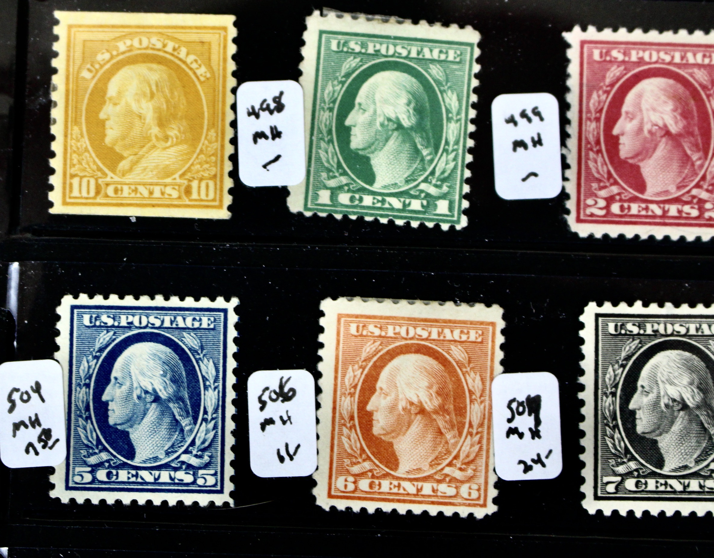 Thirty-Two Mint Hinged Washington and Franklin U.S. Postage Stamps