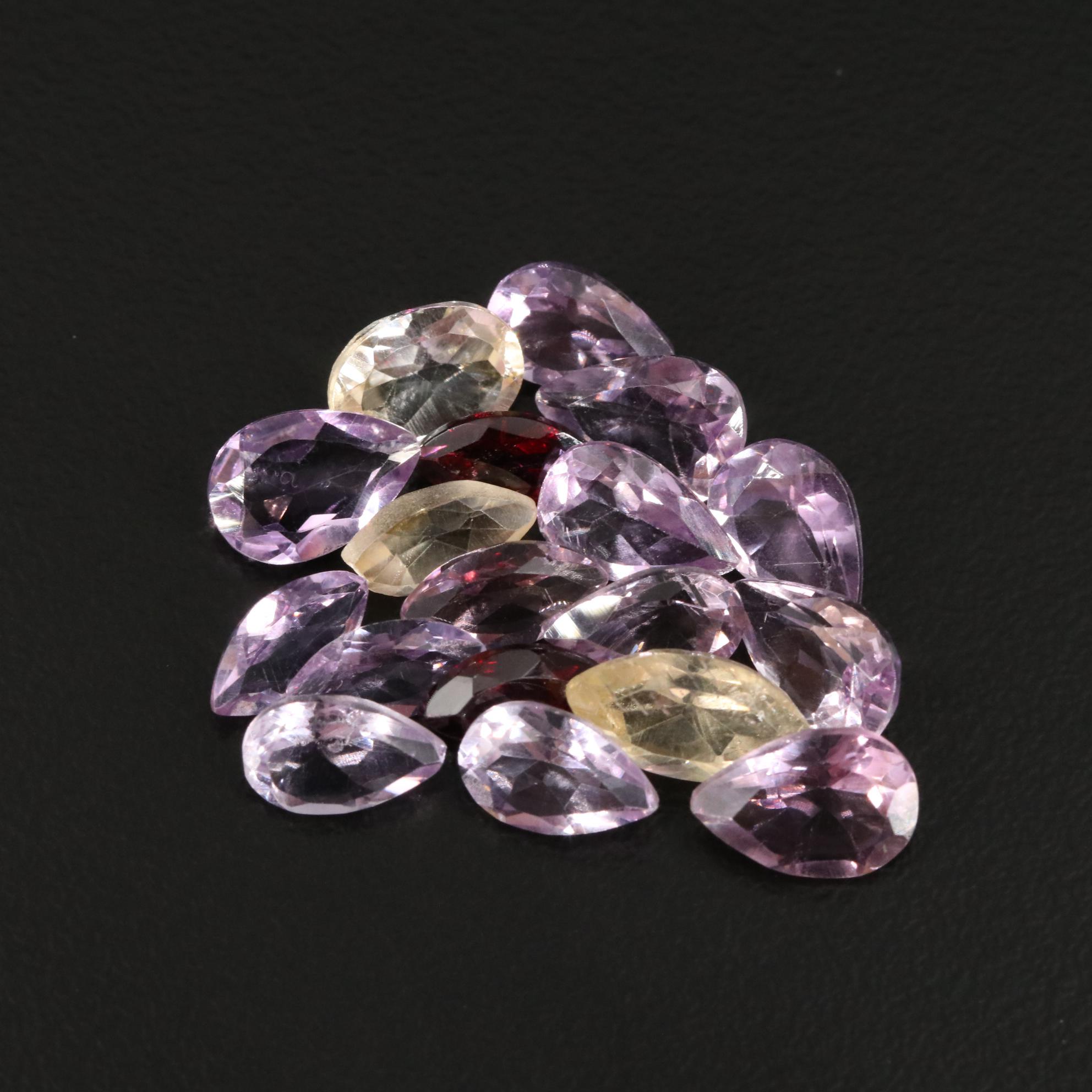 Loose 14.82 CTW Amethyst, Citrine, and Garnet Lot