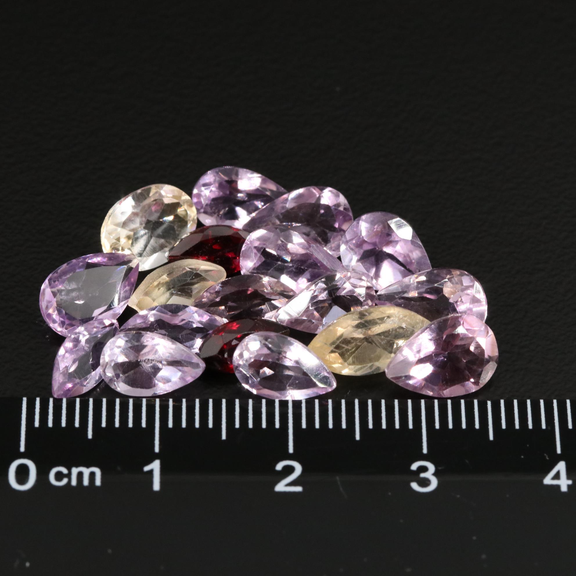 Loose 14.82 CTW Amethyst, Citrine, and Garnet Lot