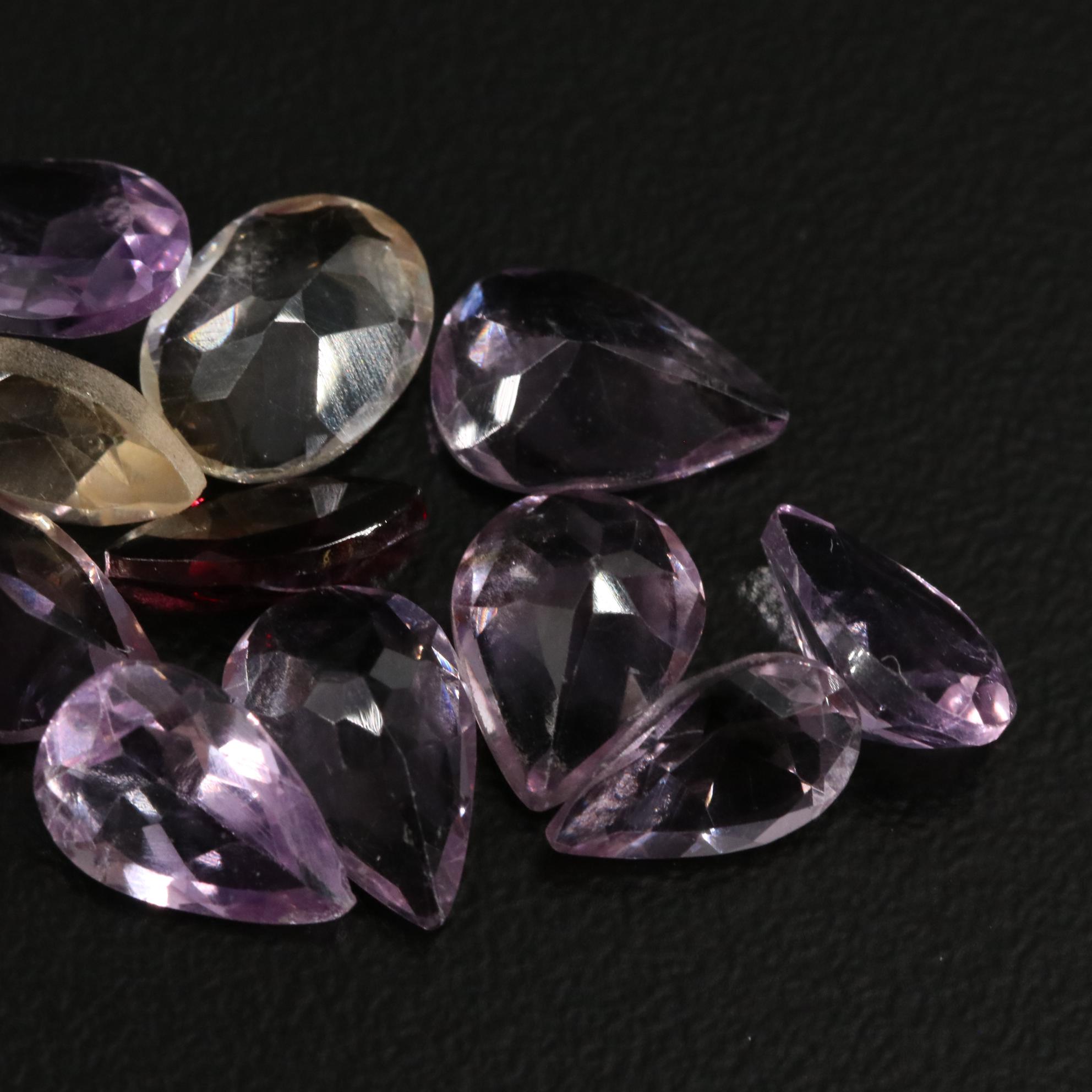 Loose 14.82 CTW Amethyst, Citrine, and Garnet Lot