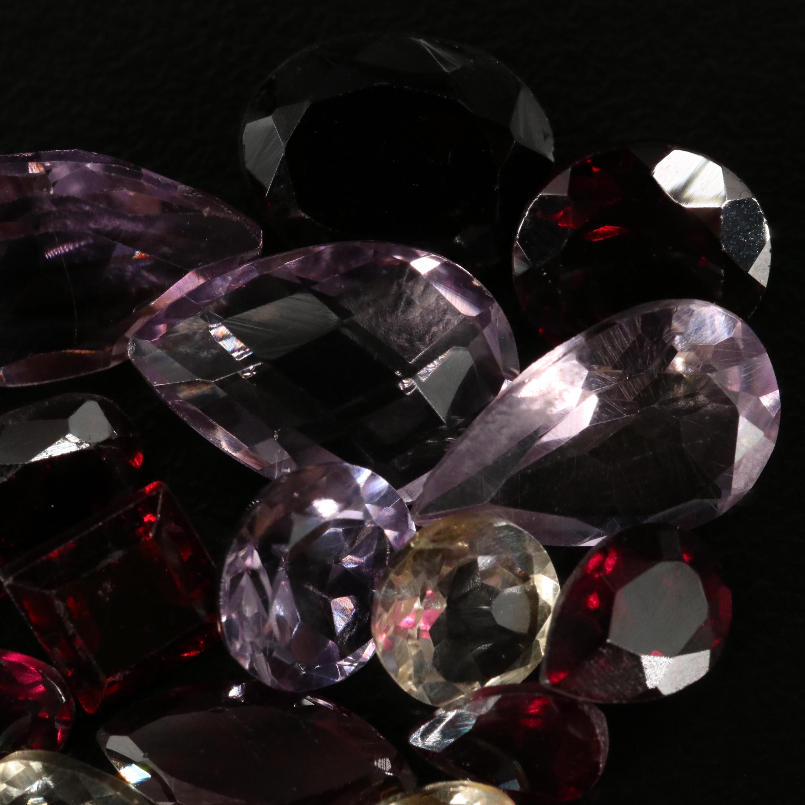 Loose 23.02 CTW Amethyst, Citrine, and Garnet Lot