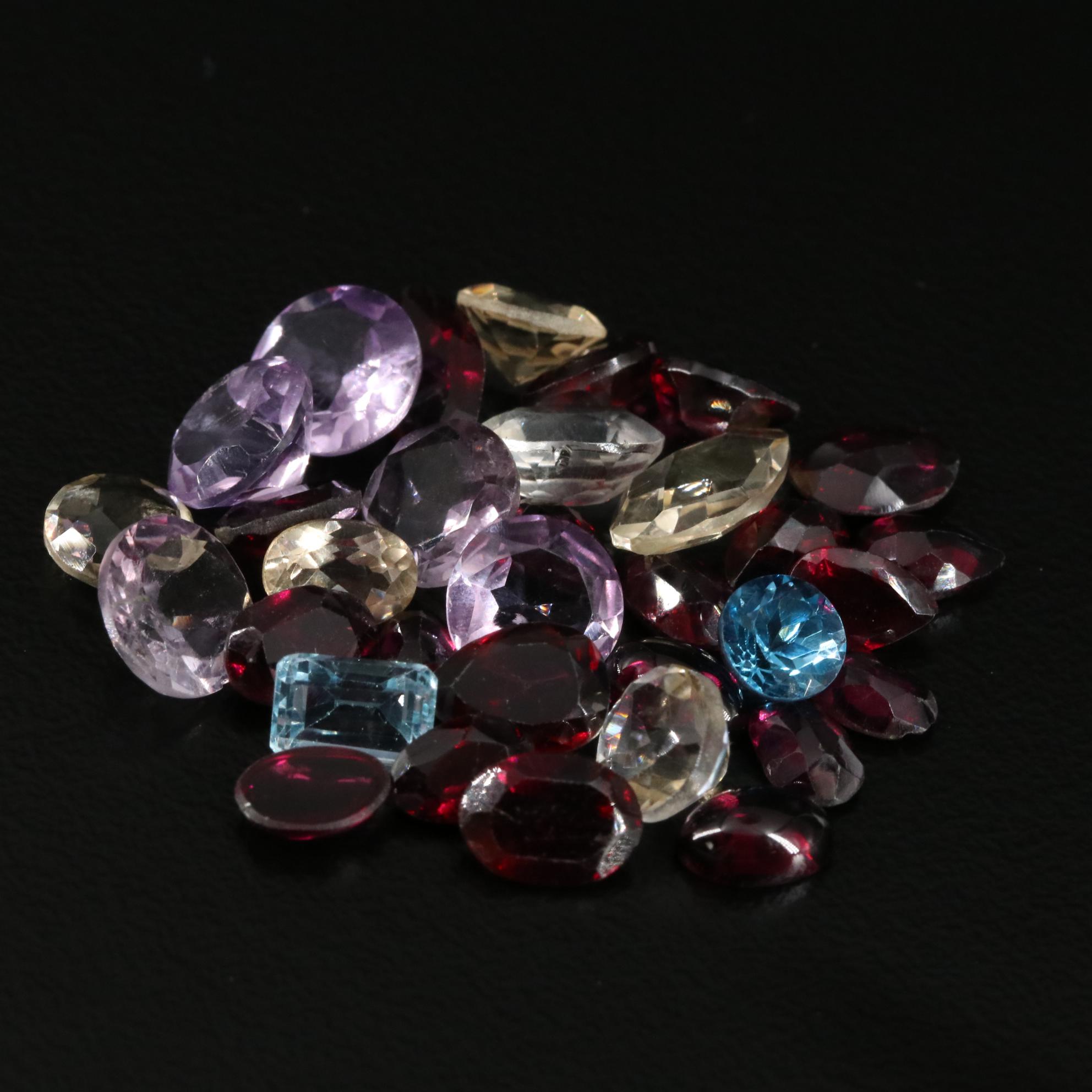 Loose 24.30 CTW Citrine, Amethyst, and Garnet Lot
