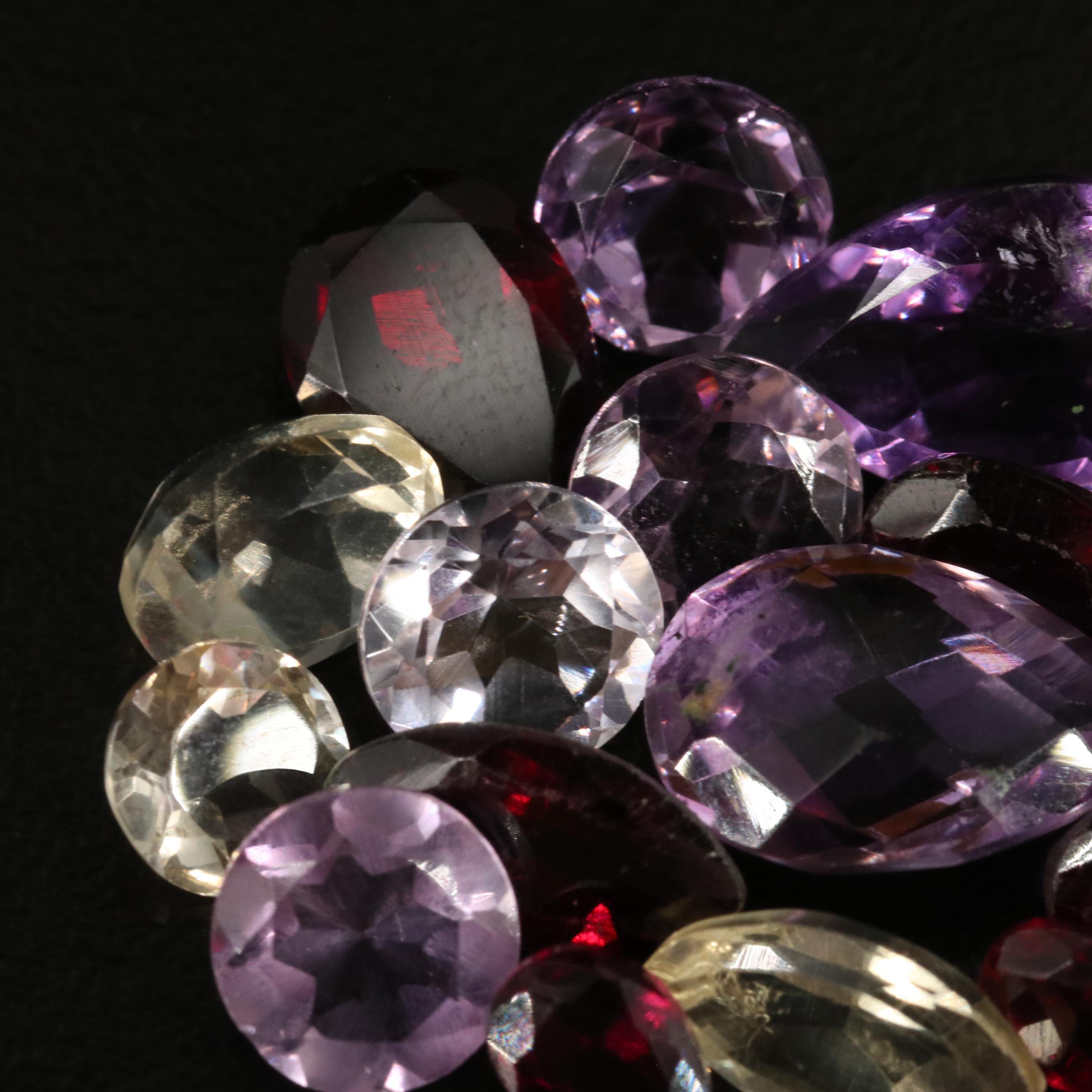 Loose 22.40 CTW Amethyst, Citrine, and Garnet Lot