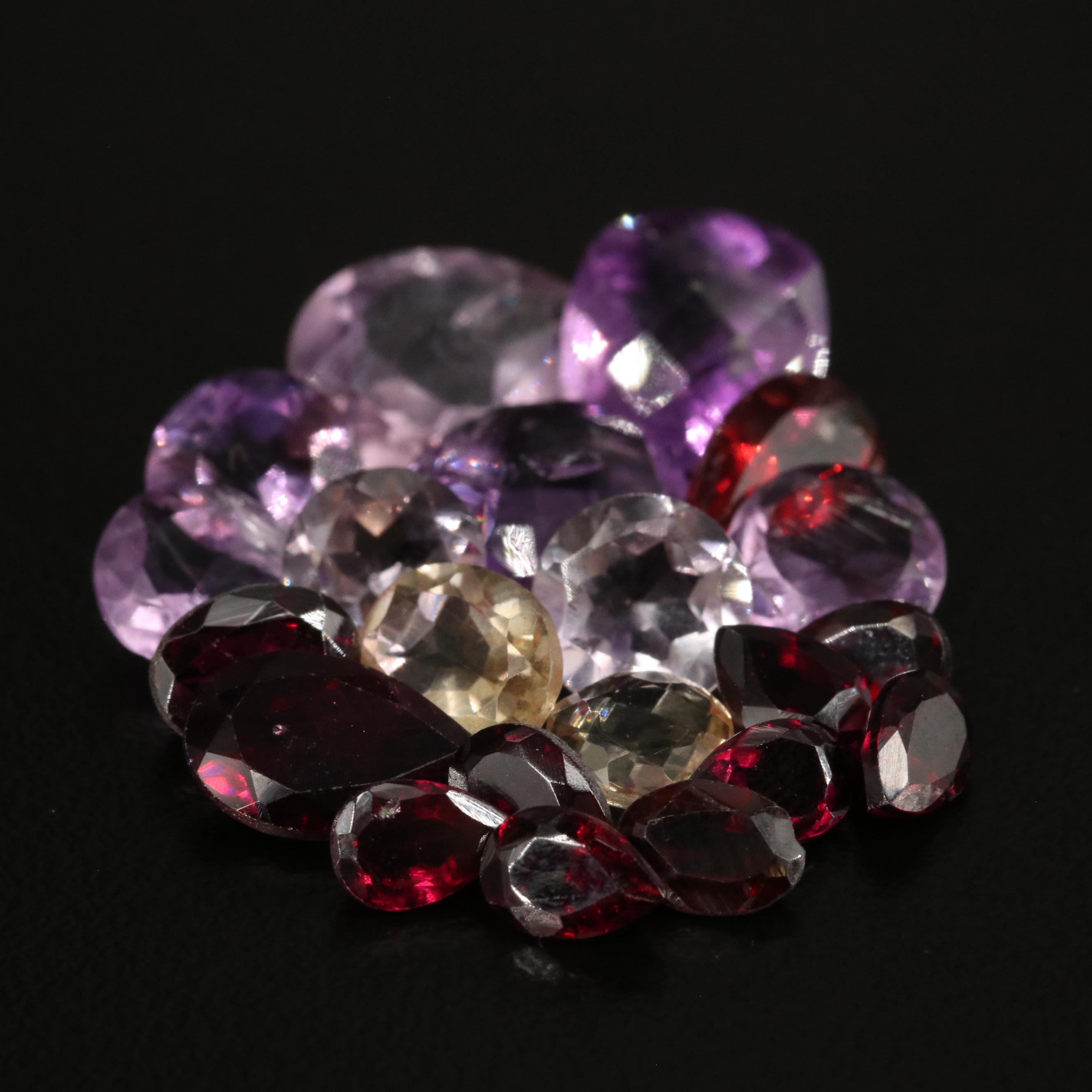 Loose 24.55 CTW Amethyst, Citrine, and Garnet Lot