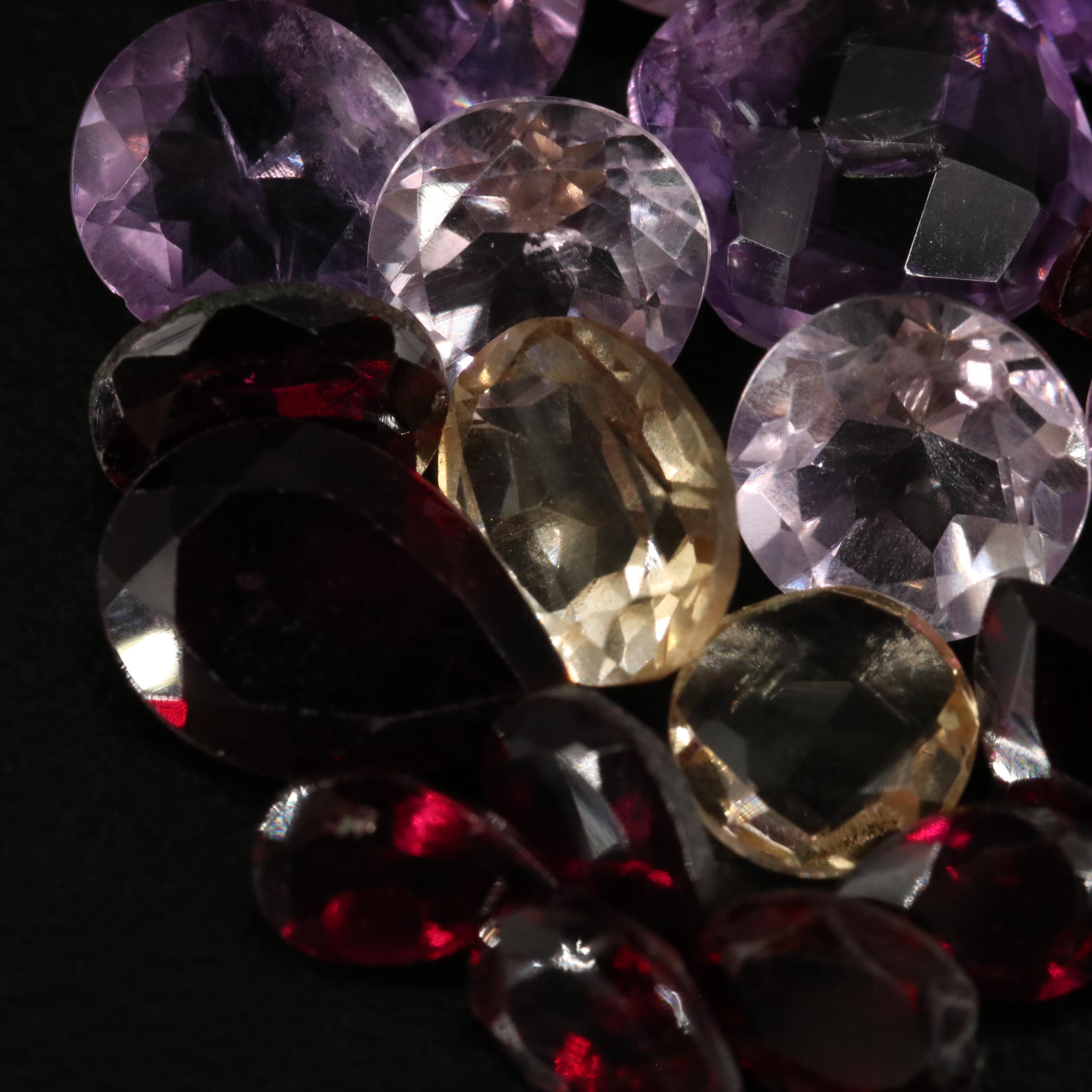 Loose 24.55 CTW Amethyst, Citrine, and Garnet Lot
