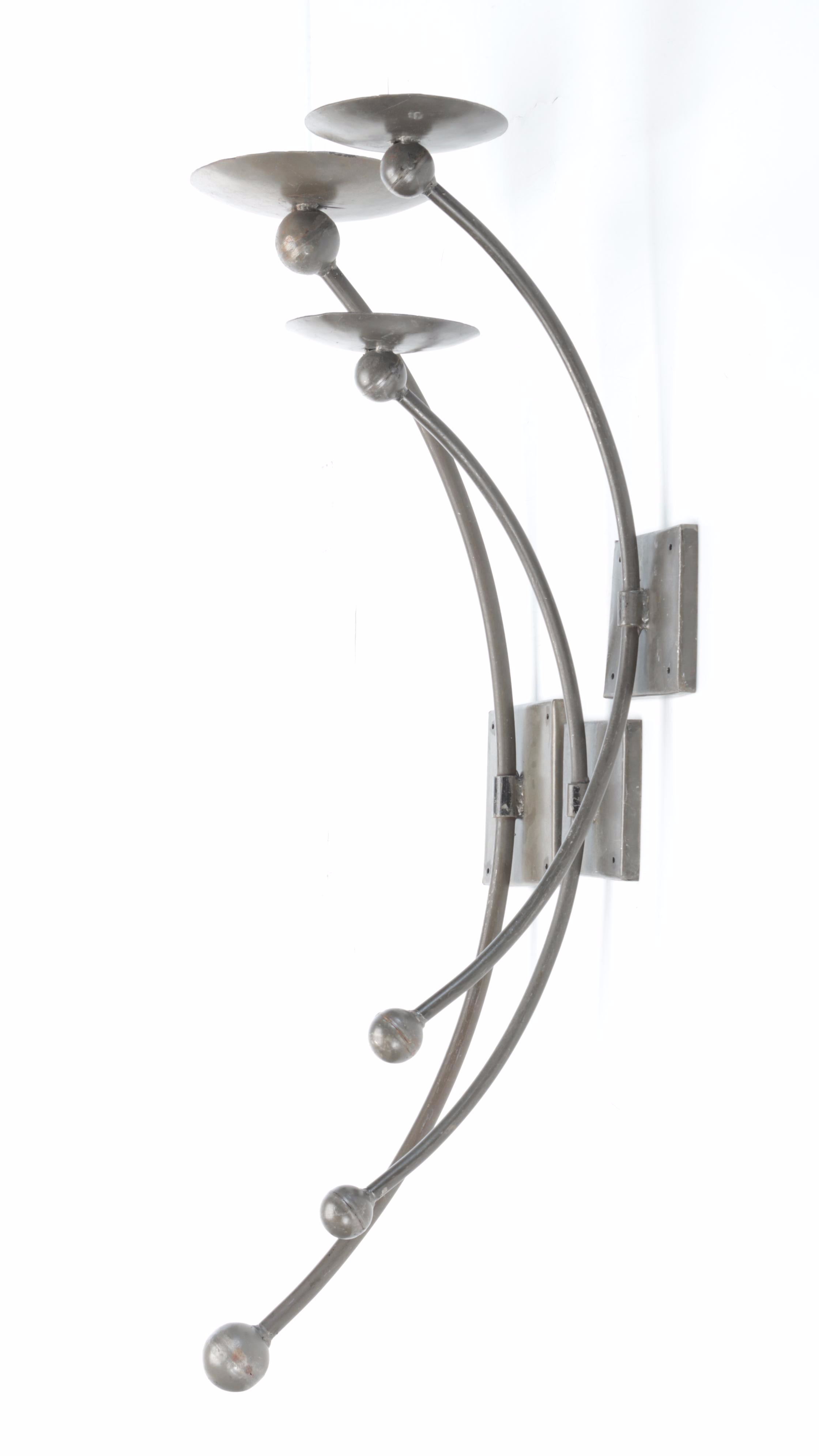 Three Metal Wall Candle Sconces With Pillar Candles