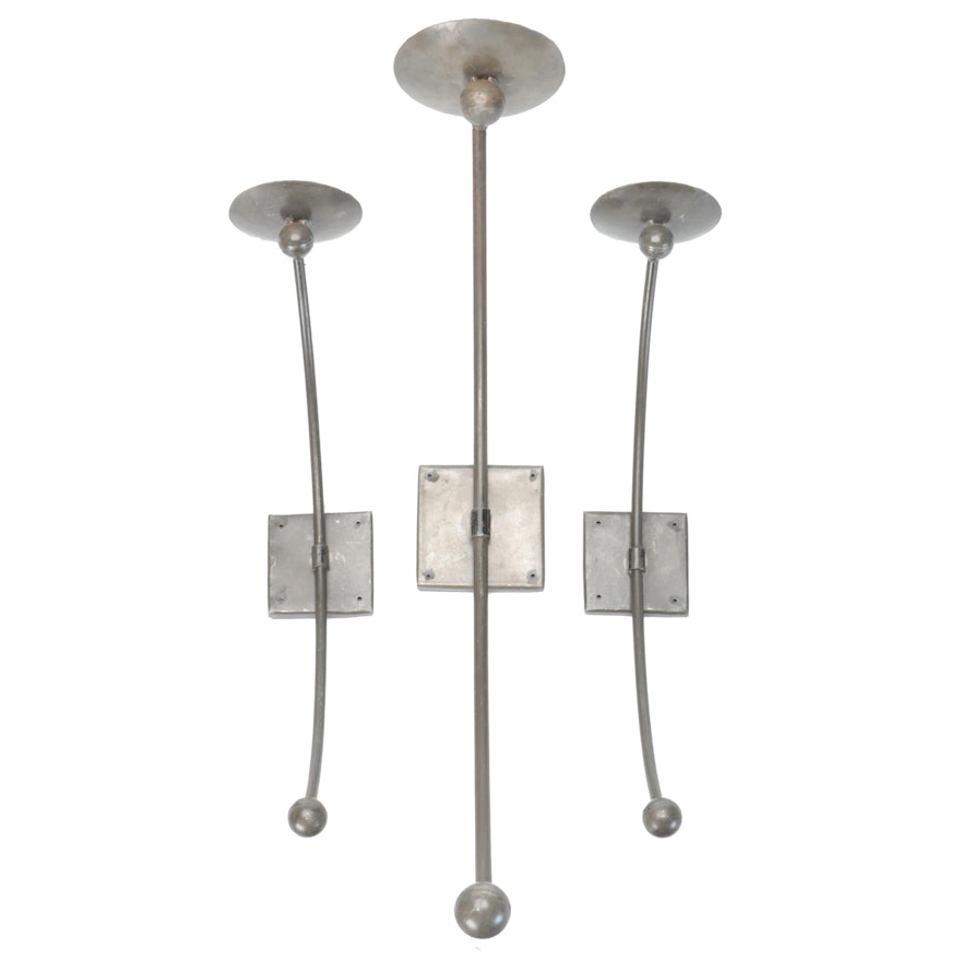Three Metal Wall Candle Sconces With Pillar Candles