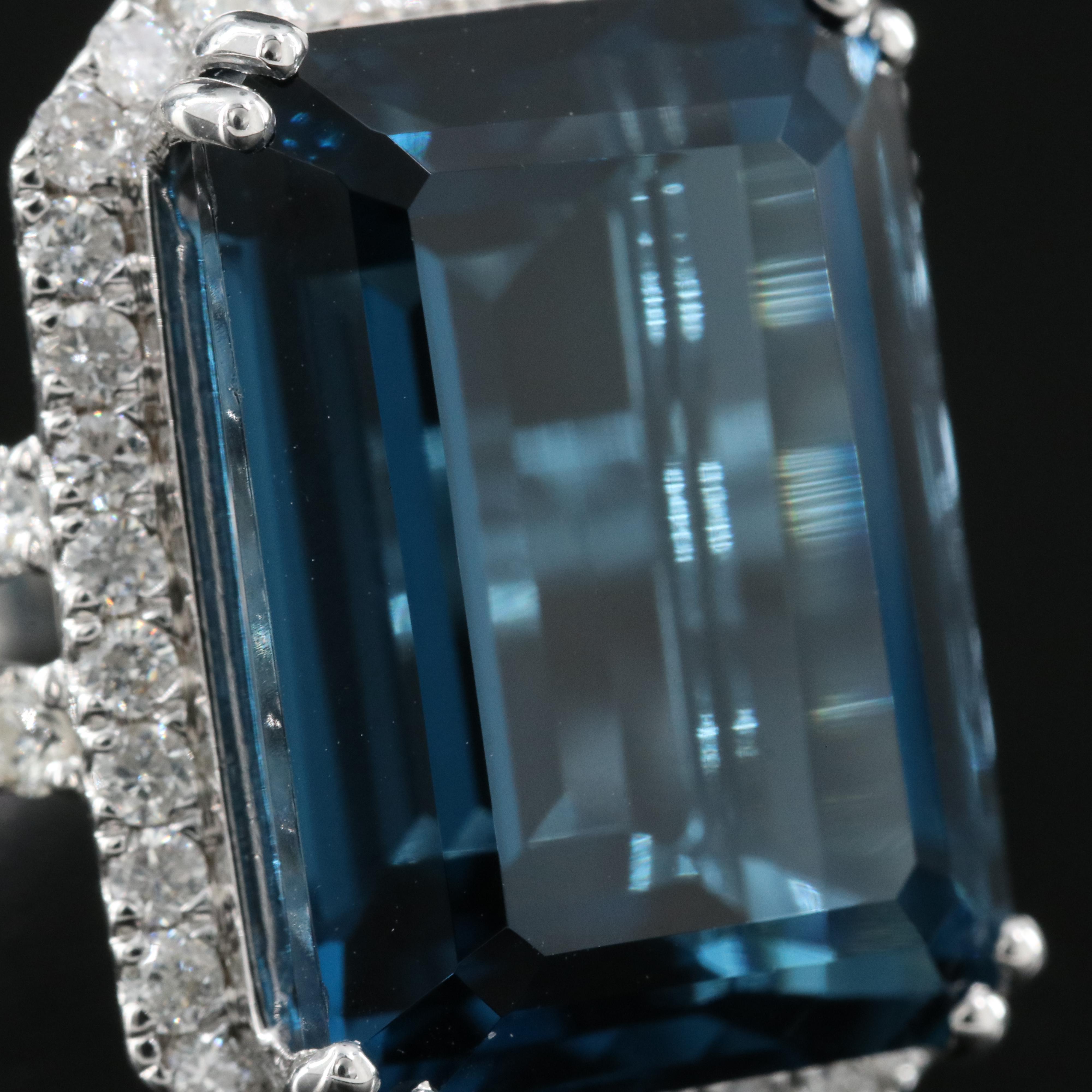 14K 21.18 CT London Blue Topaz and 1.35 CTW Diamond Halo Ring