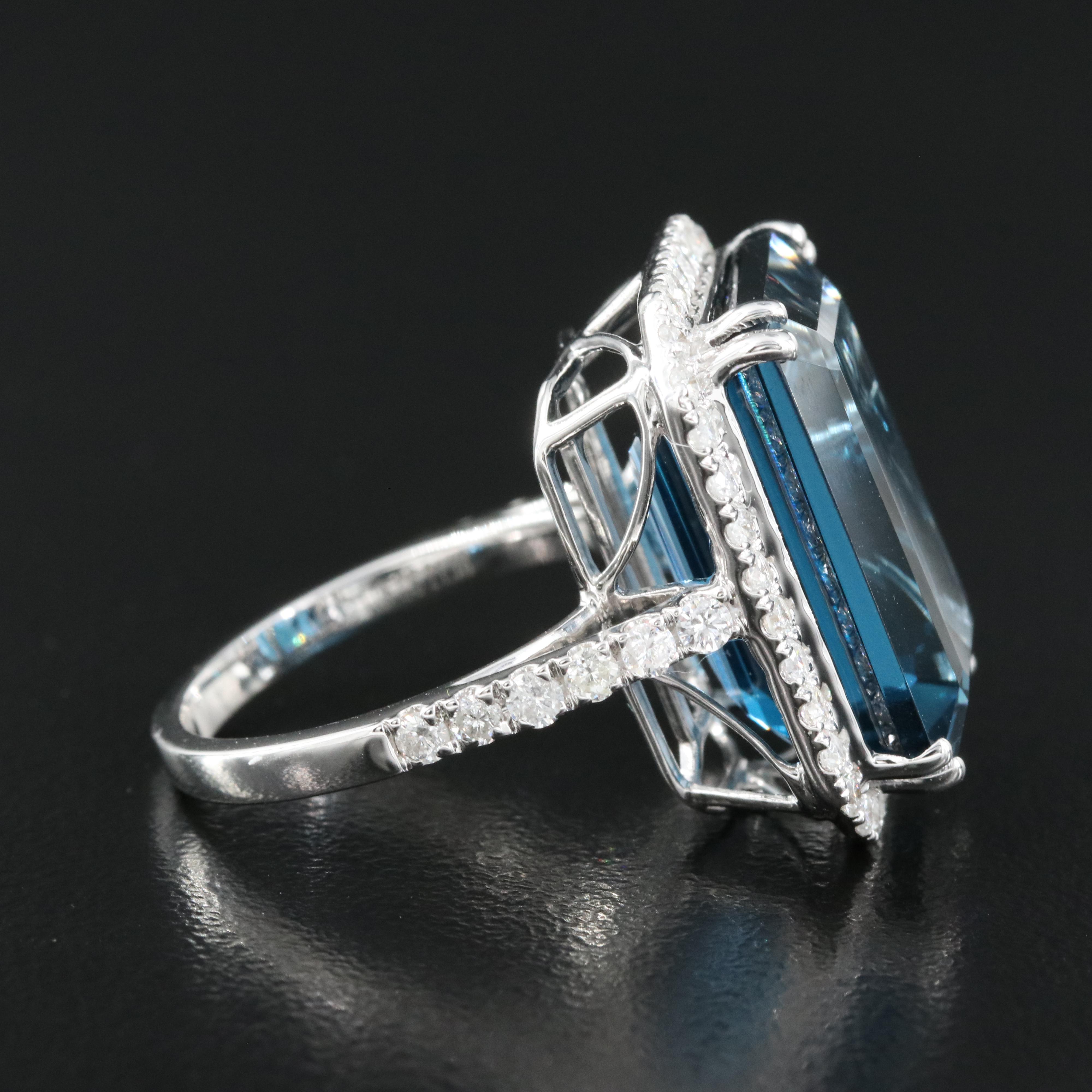 14K 21.18 CT London Blue Topaz and 1.06 CTW Diamond Halo Ring