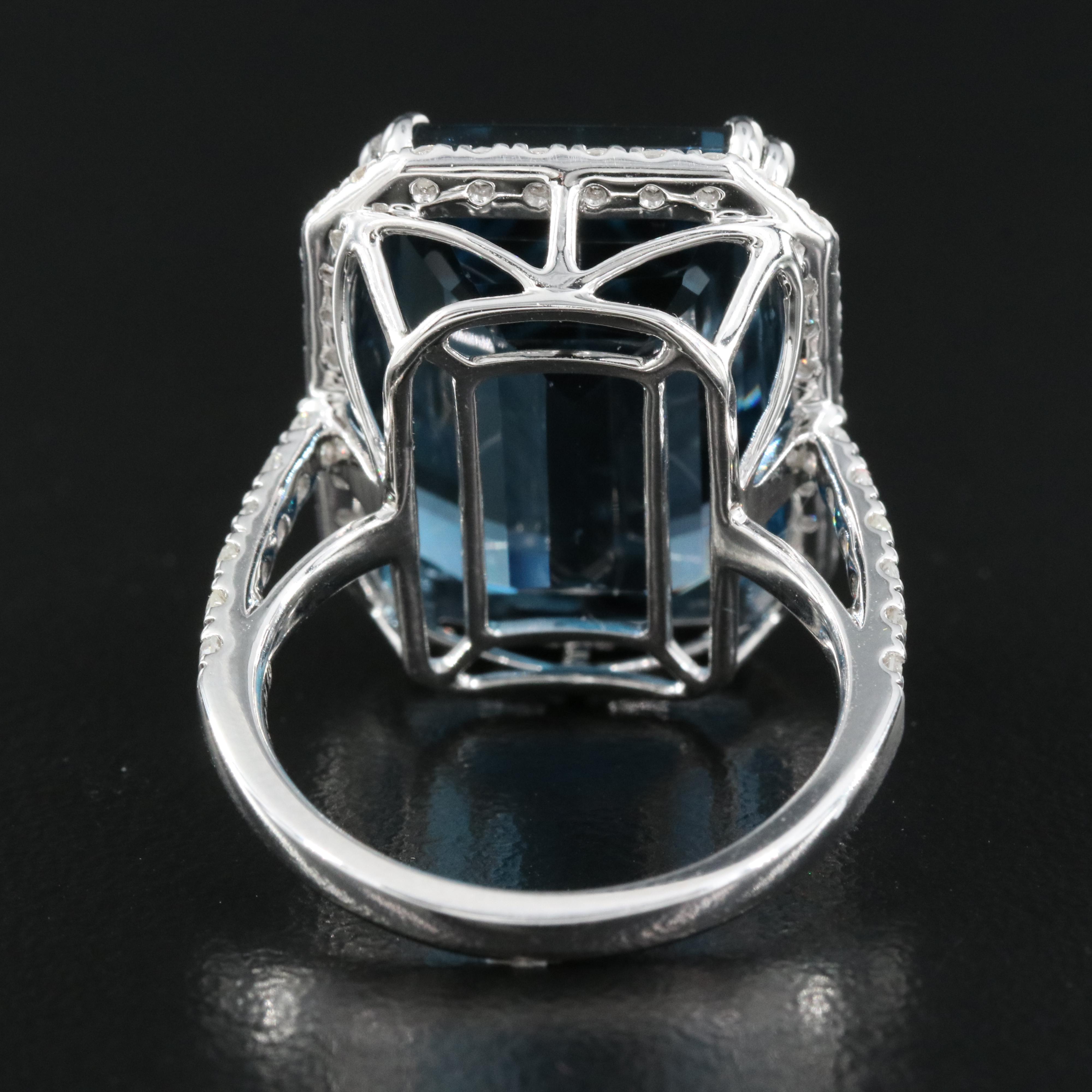 14K 21.18 CT London Blue Topaz and 1.06 CTW Diamond Halo Ring