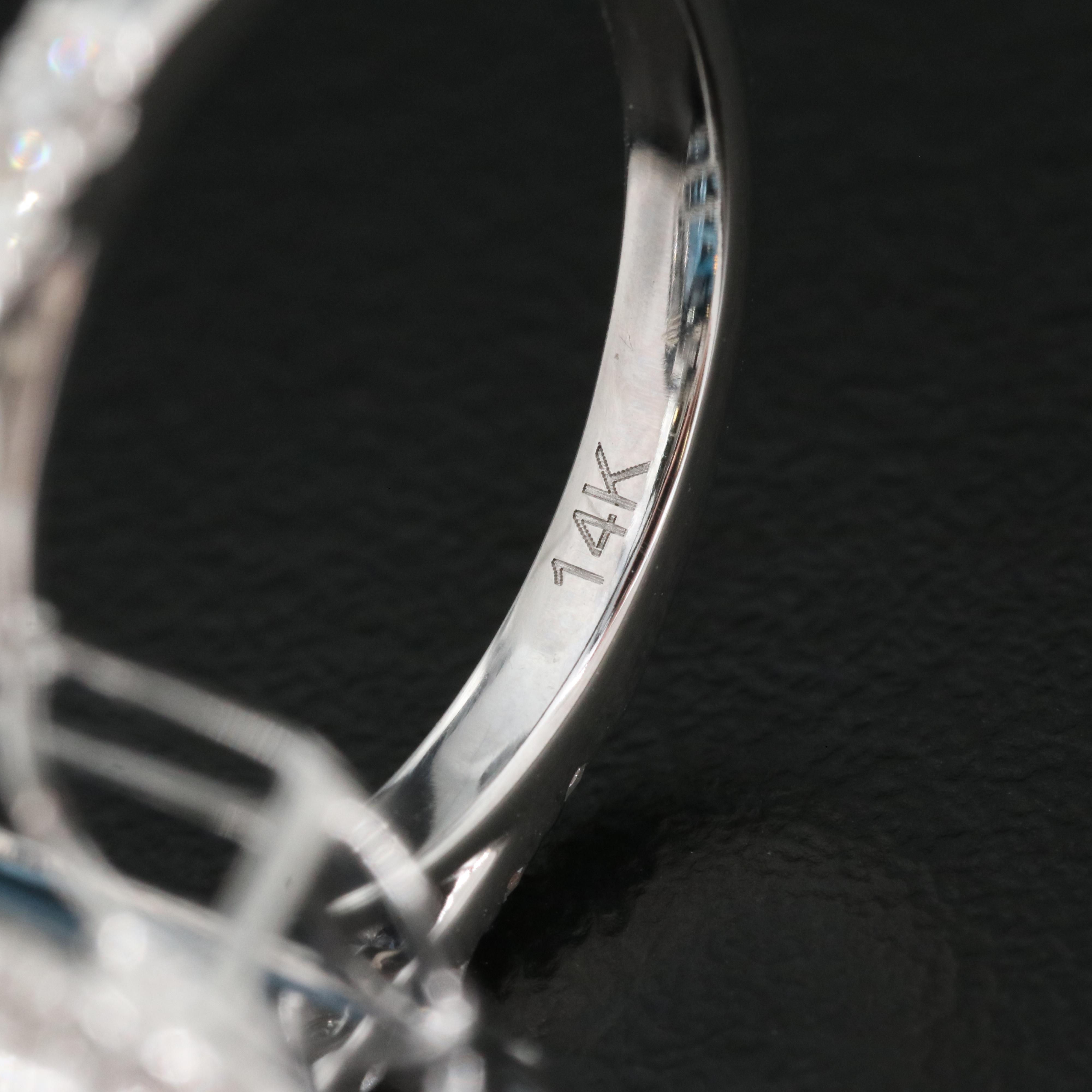 14K 21.18 CT London Blue Topaz and 1.06 CTW Diamond Halo Ring