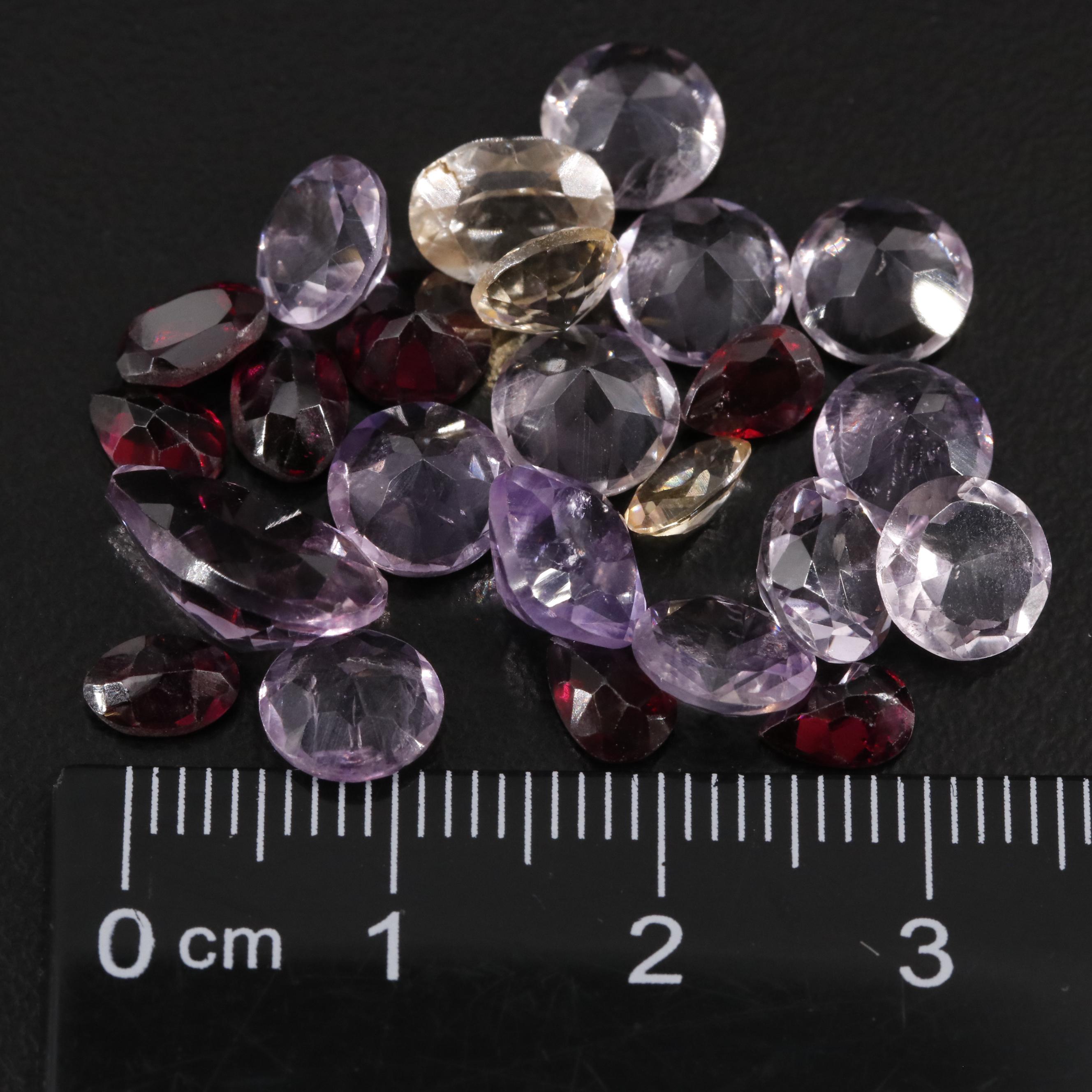 Loose 23.35 CTW Amethyst, Citrine, and Garnet Lot