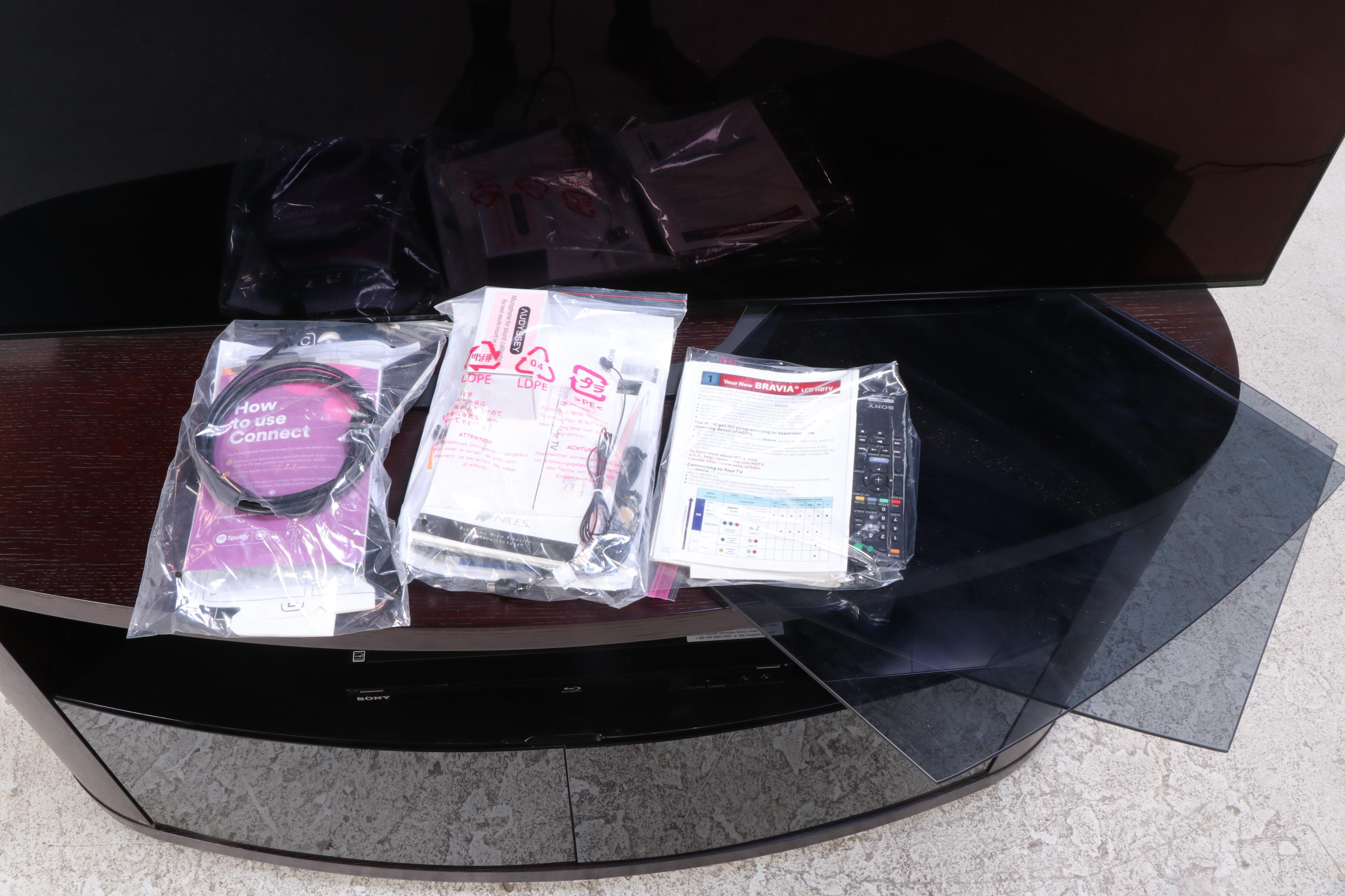 Sony XBR 65" 4K UHD LCD Television with Entertainment Stand and Blu-Ray Player