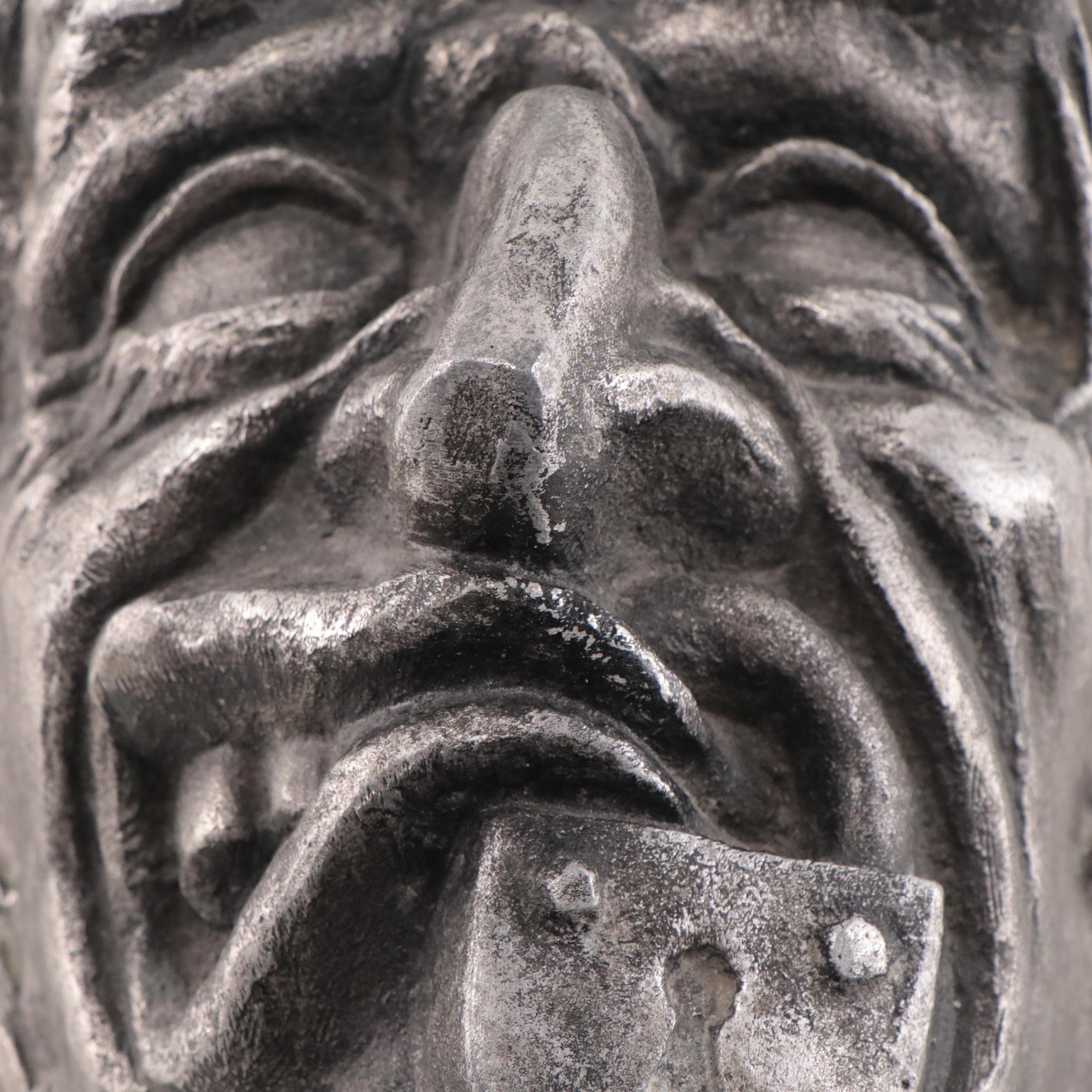 Cast Metal Portait of Old Man With Locked Mouth