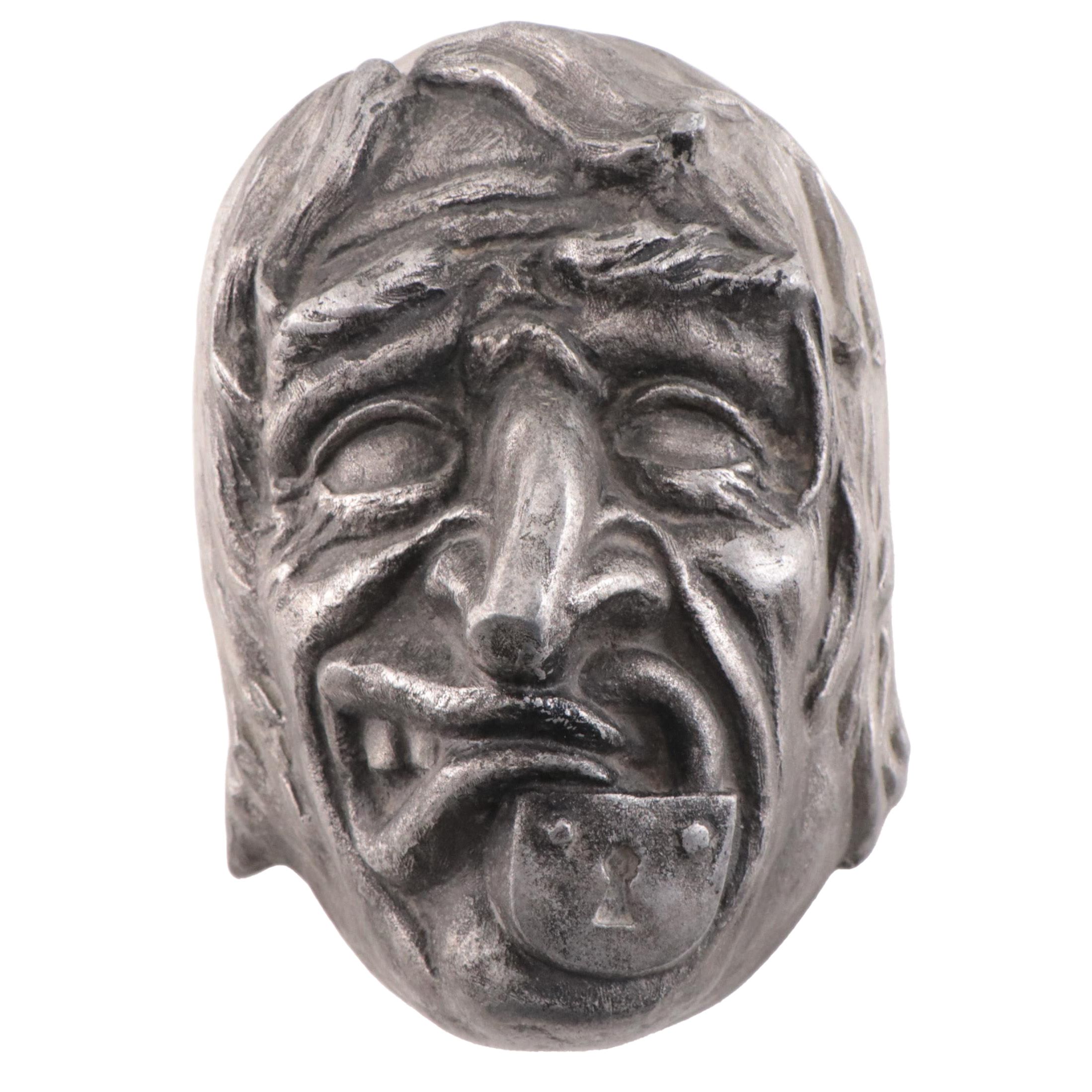 Cast Metal Portait of Old Man With Locked Mouth